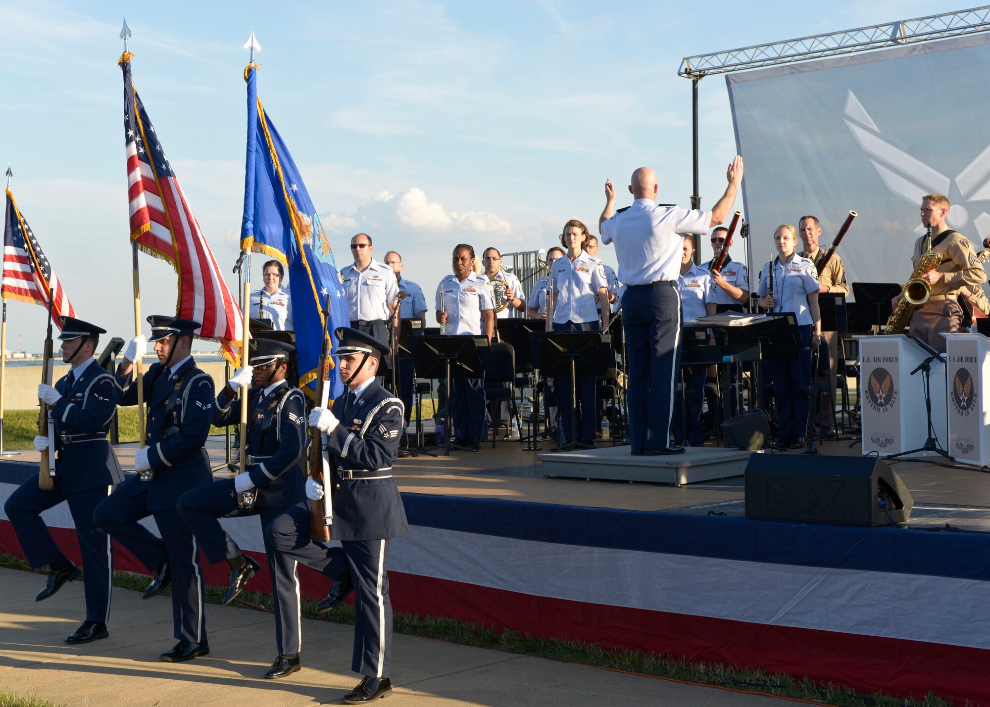 The Langley Air Force Base Honor Guard presents the colors during the “Turning the Tide” concert, a tribute to the 70th anniversary of D-Day at Fort Monroe Continental Park in Norfolk Va., June 6, 2014.  The band held the concert to commemorate the contributions of War World II veterans. (U.S. Air Force photo by Senior Airman Connor Estes/Released)