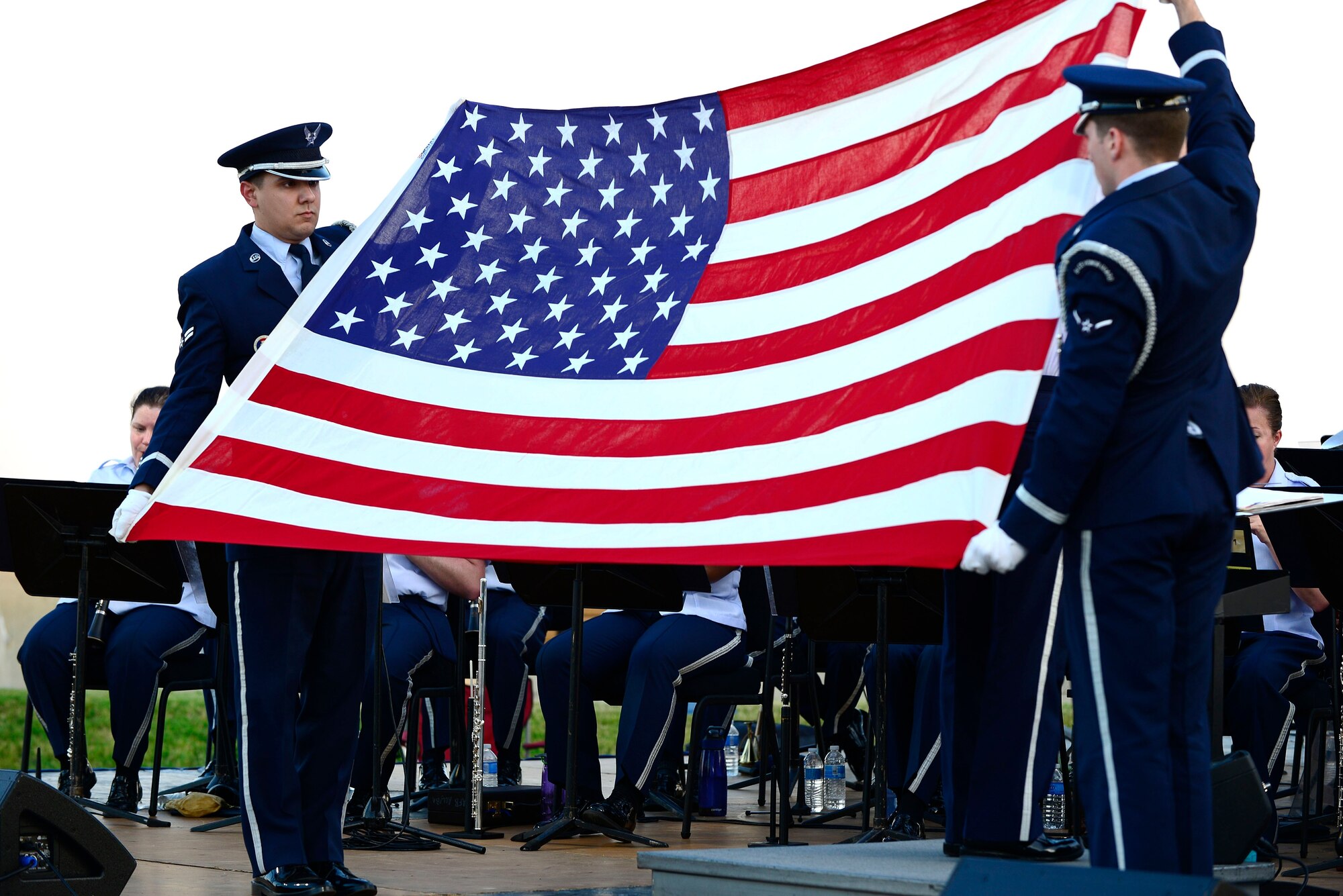 The Langley Air Force Base Honor Guard performs a ceremonial flag folding during the U.S. Air Force Heritage of America Band’s “Turning the Tide” concert at Fort Monroe Continental Park in Norfolk Va., June 6, 2014. The concert commemorated the 70th anniversary of D-Day. (U.S. Air Force photo by Senior Airman Connor Estes/Released)
