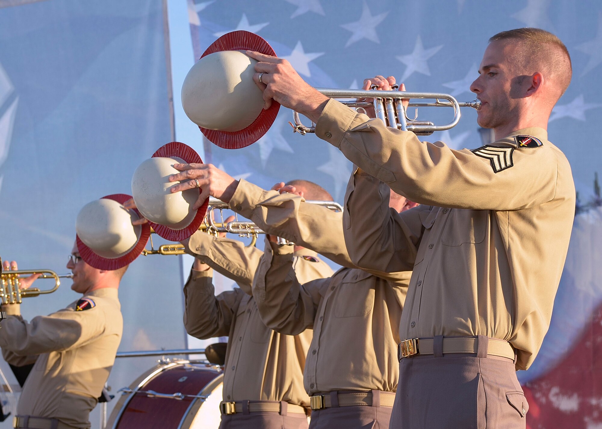 Members of the U.S. Air Force Heritage of America Band perform World War II big band-style music during the “Turning the Tide” concert at Fort Monroe Continental Park in Norfolk Va., June 6, 2014. Band members performed songs in tribute to the 70th Anniversary of D-Day and told stories of veterans who helped turn the tide of War World II. (U.S. Air Force photo by Senior Airman Connor Estes/Released)