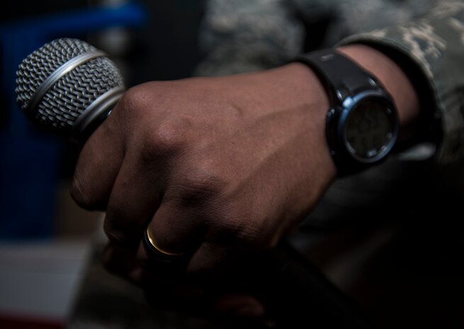 Airman 1st Class Kyren Gantt, 628th Security Forces Squadron patrolman, waits in the dugout, June 6, 2014, at Joseph P. Riley Park in Charleston, S.C. Gantt’s family was on the field listening to what they believed was a pre-recorded message from Gantt, but it was actually him speaking from the dugout. After delivering his message, Gantt walked onto the field where he reunited with his family who he had not seen in eight months. (U.S. Air Force photo/ Airman 1st Class Clayton Cupit)