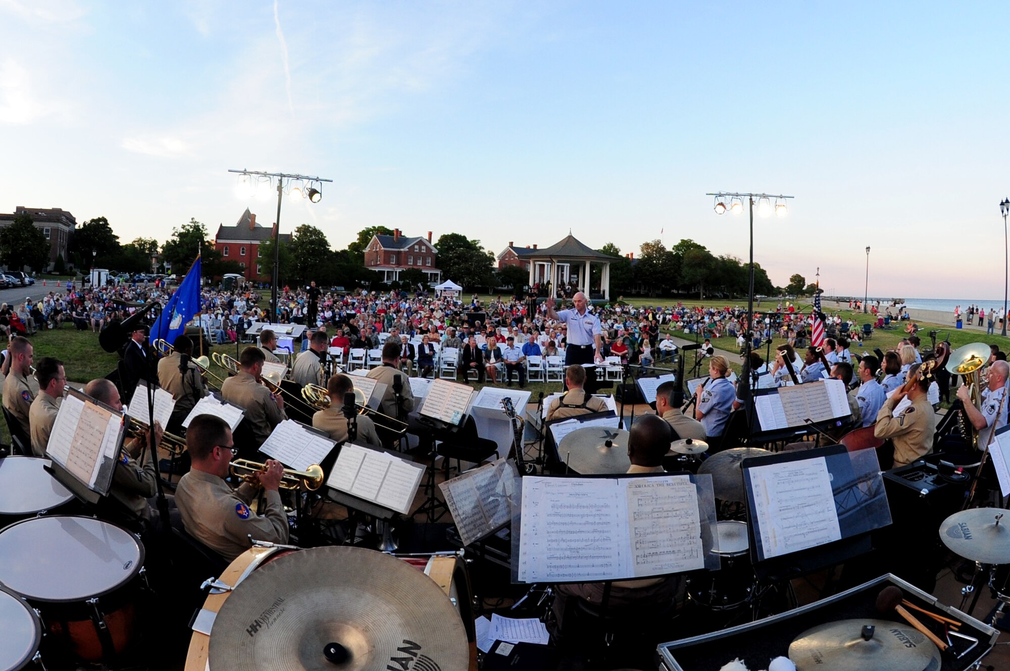 Attendees listen as the U.S. Air Force Heritage of America Band performs during the “Turning the Tide” concert at Fort Monroe, Va., June 6, 2014. The band performed songs to include “Each Time You Tell Their Story” and “None So Beautiful as the Brave,” during a tribute to the 70th anniversary of D-Day. (U.S. Air Force photo by Airman 1st Class Areca T. Wilson/Released)