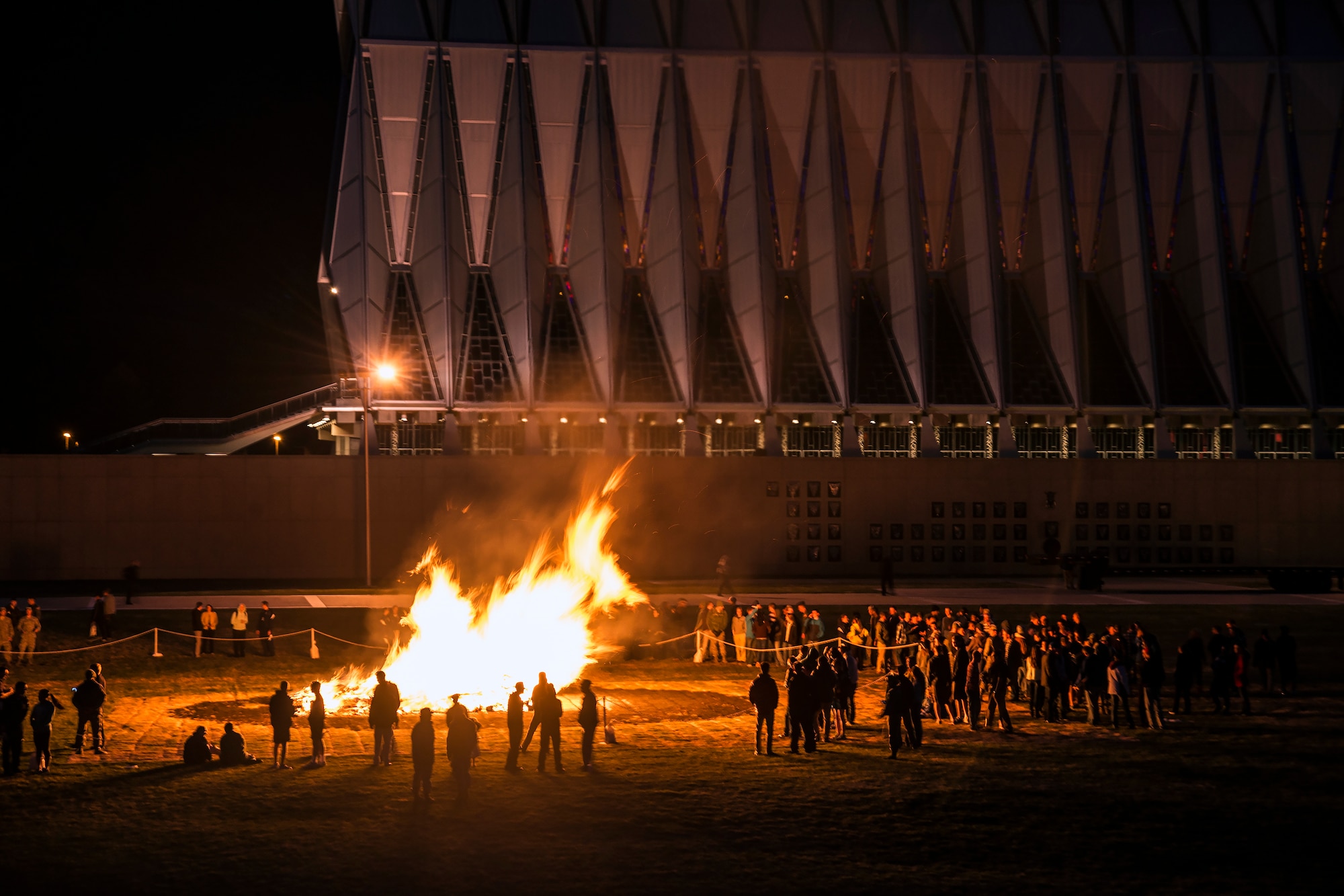 Academy cadets and staff members gather around a bonfire in observance of sexual assault awareness month for the 'Take Back the Night' event April 17. (U.S. Air Force Photo/Liz Copan)