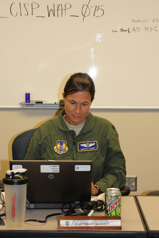Col. Cheryl Lowry, a member for the Air Force Medical Service, was hard at work in her Air War College seminar prior to graduation. Col. Lowry's efforts were recognized with the Wright Brothers Officership Award that she received upon Air War College graduation on May 22, 2014 at Maxwell Air Force Base, AL. 

The Wright Brothers Officership Award is awarded by the AWC Commandant to the
student who makes the most significant contributions to the college's educational objectives and who demonstrated the top professional leadership, officership, and educational achievement. (Courtesy Photo)