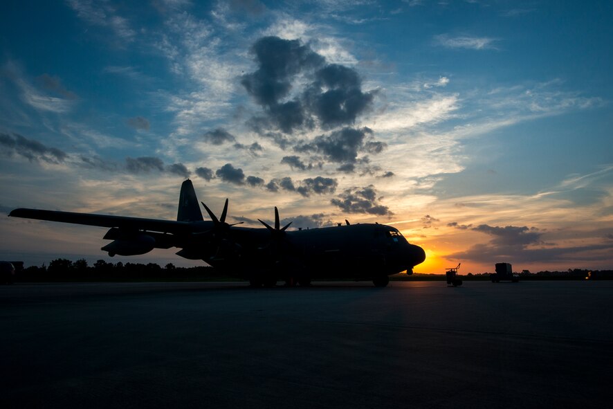 The sun rises over an HC-130J Combat King II at Moody Air Force Base, Ga., June 5, 2014. Moody’s 71st Rescue Squadron flies rescue missions with both the HC-130J and the HC-130P Combat King. (U.S. Air Force photo by Airman 1st Class Ryan Callaghan/Released)