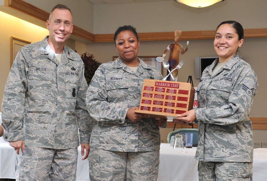 Col. Tom Wilcox, 341 Missile Wing commander, poses with Staff Sgt. Shari Elliott and Senior Airman Renee Murray, representing the 341st Force Support Squadron fitness center, following the team’s win at Warrior Chef June 3. Elliott and Murray’s main entrée was pan-seared salmon with avocado, shrimp avocado salad and avocado-blueberry smoothies completing the presentation. (U.S. Air Force photo / John Turner)