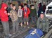 WRIGHT-PATTERSON AIR FORCE BASE, Ohio - Senior Airman Andrew Ferguson, 445th Aeromedical Evacuation Squadron AES technician, demonstrates how to move a patient litter during the 445th Airlift Wing Scouts Day May 17. More than 50 Boy and Cub Scouts from around the state enjoyed a morning of activities on the 445th flightline, to include a tour of a C-17 Globemaster III, base fire truck, and demonstrations by the 445th Security Forces Squadron. (U.S. Air Force photo/Lt. Col. Denise Kerr)