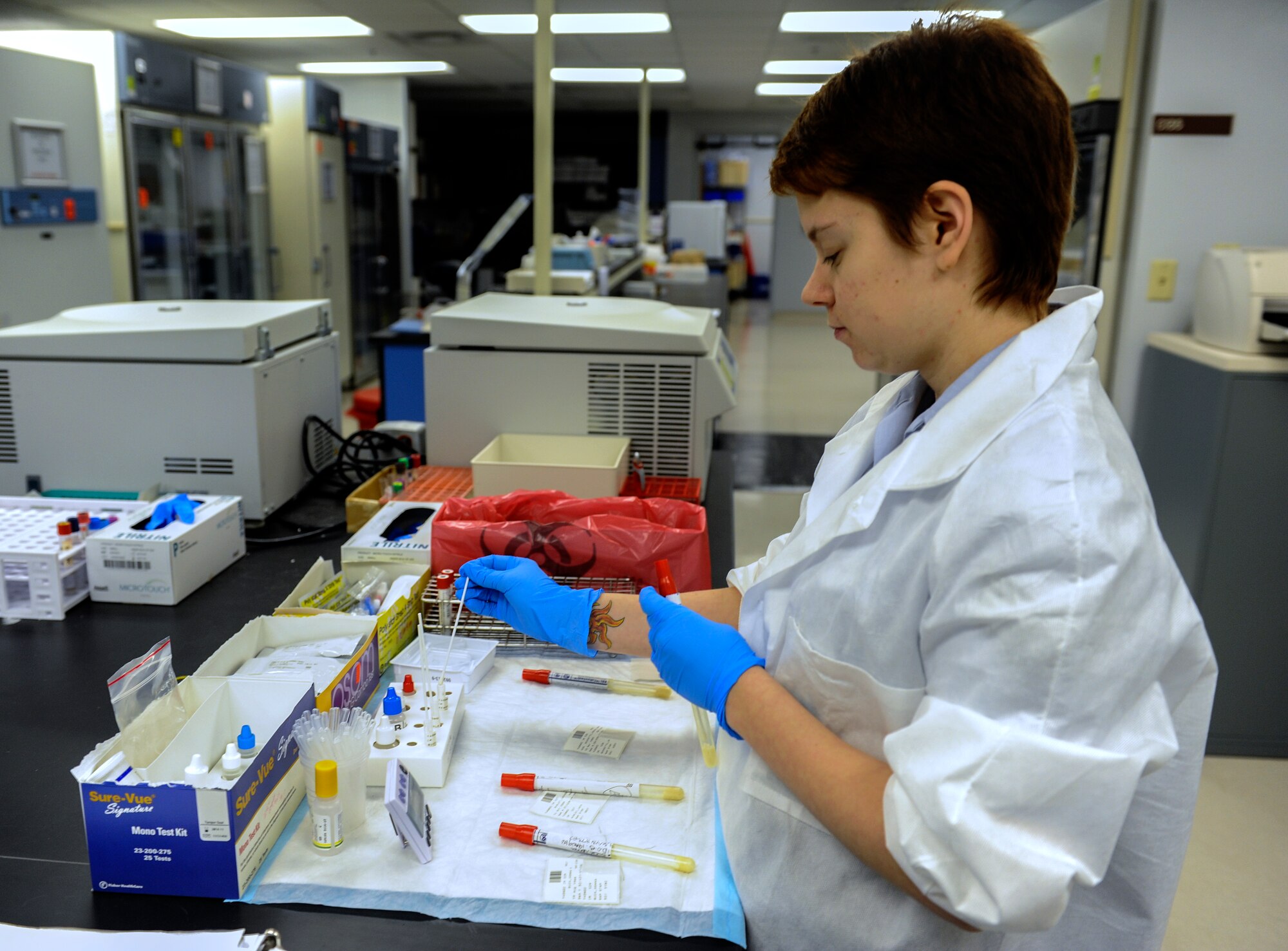 Senior Airman Kimberly Chu, a 19th Medical Support Squadron medical lab technician, tests throat cultures for Strep-A at the base lab June 2, 2014, at Little Rock Air Force Base, Ark. The rapid strep test takes only five minutes to complete in the lab. (U.S. Air Force photo by Staff Sgt. Jessica Condit)