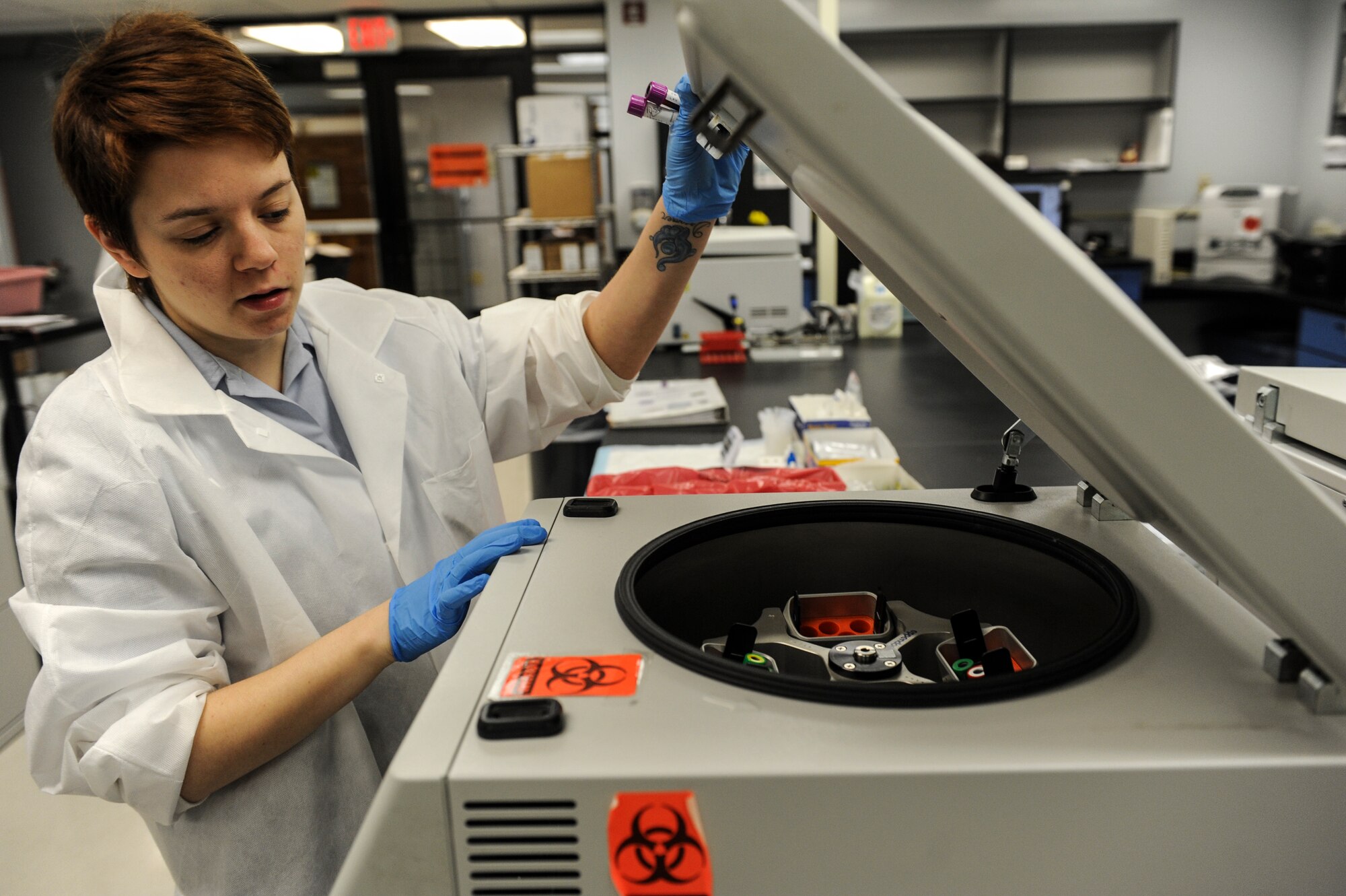 Senior Airman Kimberly Chu, a 19th Medical Support Squadron medical lab technician, runs chemistry tests through the Dimension RXL Max June 2, 2014, at Little Rock Air Force Base, Ark. The machine can run up to 60 vials of blood at a time and has the ability to test for up to 37 different in-house chemistry tests at once. (U.S. Air Force photo by Staff Sgt. Jessica Condit)
