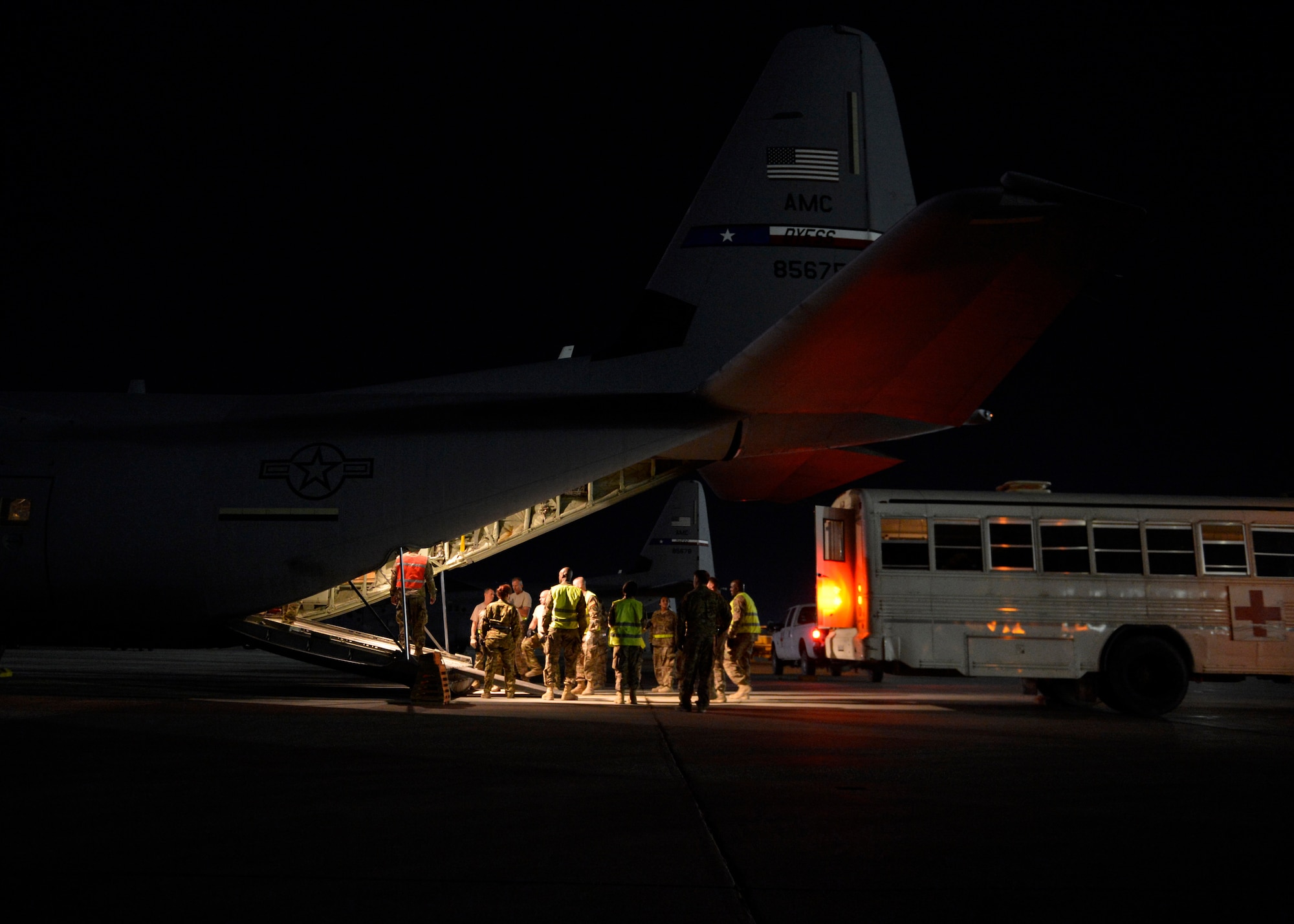 U.S. Air Force Airmen from the 455th Expeditionary Aeromedical Evacuation Squadron prepare to unload patients at Bagram Airfield, Afghanistan May 29, 2014.  The Aeromedical Evacuation squadron transports and treats ill and injured personnel throughout Afghanistan. The unit uses fixed-wing aircraft such as the C-130J Super Hercules, which allows larger patient loads, long-distance transportation and a greater ability to care for injured members. (U.S. Air Force photo by Staff Sgt. Evelyn Chavez/Released)  