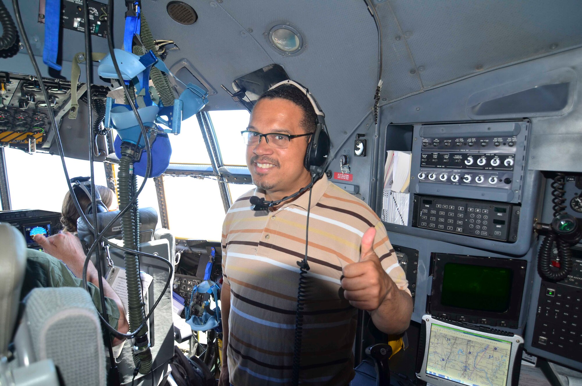 Minnesota Congressman Keith Ellison, gives thumbs up during a congressional orientation flight June 6.  Staffers from his office and the offices of Sen. Amy Klobuchar, Sen. Al Franken, Cong. John Kline and Cong. Michele Bachmann flew on a training mission aboard a 934th Airlift Wing C-130 aircraft. (Air Force Photo/Paul Zadach)