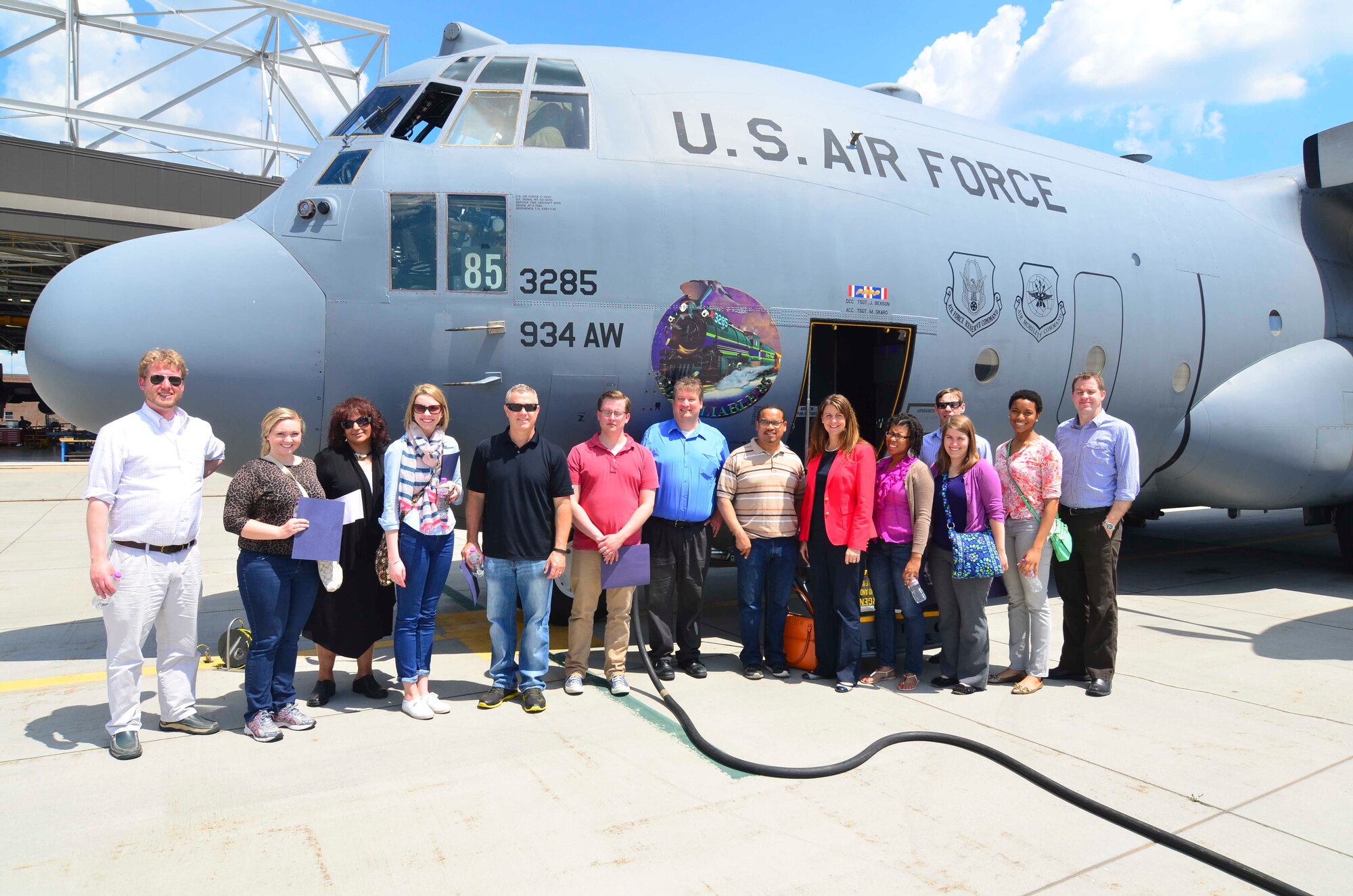 Minnesota Congressman Keith Ellison, staffers from his office and the offices of Sen. Amy Klobuchar, Sen. Al Franken, Cong. John Kline and Cong. Michele Bachmann stand with the 934th Airlift Wing C-130 they flew aboard June during a Congressional orientation flight. (Air Force Photo/Paul Zadach)