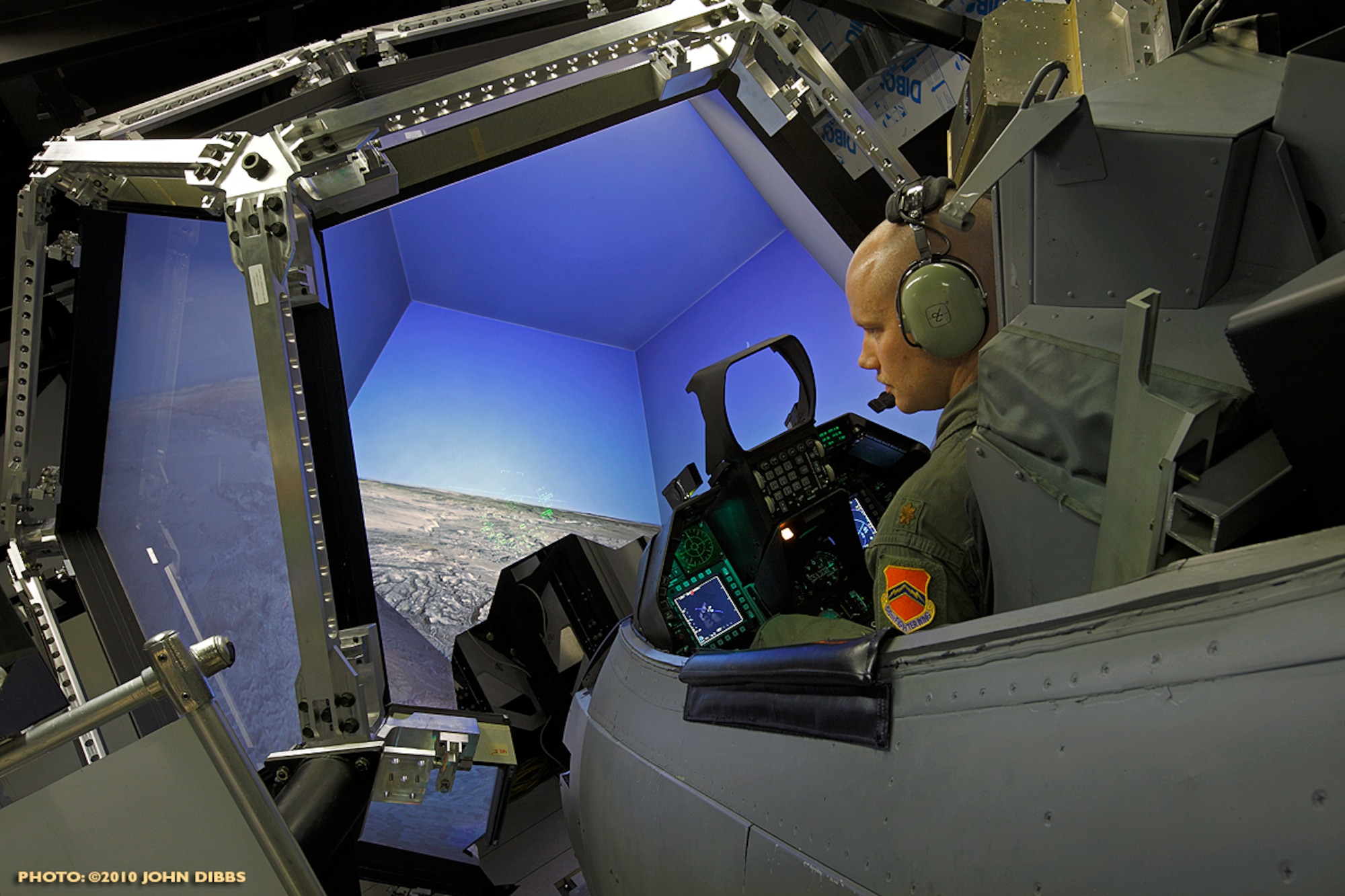 Maj. Brandon McBrayer, 56th TRS training systems alternate director of operations, simulates a flying mission at the network training center. The 56th TRS provides academic, simulator and live mission training for more than 75 upgrading weapons directors annually. (Courtesy photo)