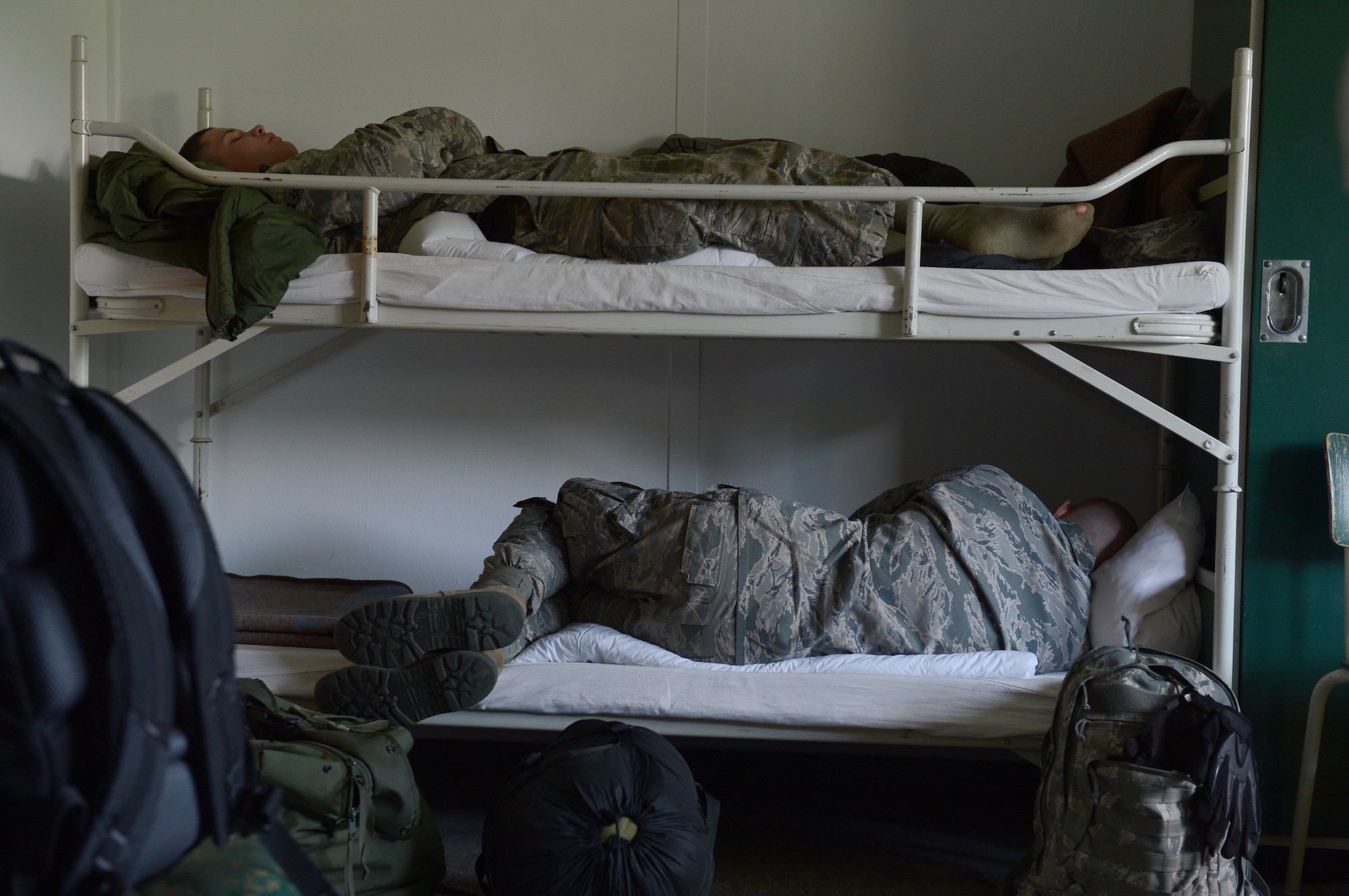 U.S. Air Force Airmen sleep at a Bundeswehr Army Post, Schwarzenborn, Germany, while they wait for convoy vehicle repairs from Spangdahlem Air Base, Germany, June 3, 2014. Airmen from the 606th Air Control Squadron convoyed to Poland to support NATO air assets from the United Kingdom, France, U.S. and Poland with ground-to-air communications during two military exercises. (U.S. Air Force photo by Airman 1st Class Kyle Gese/Released)