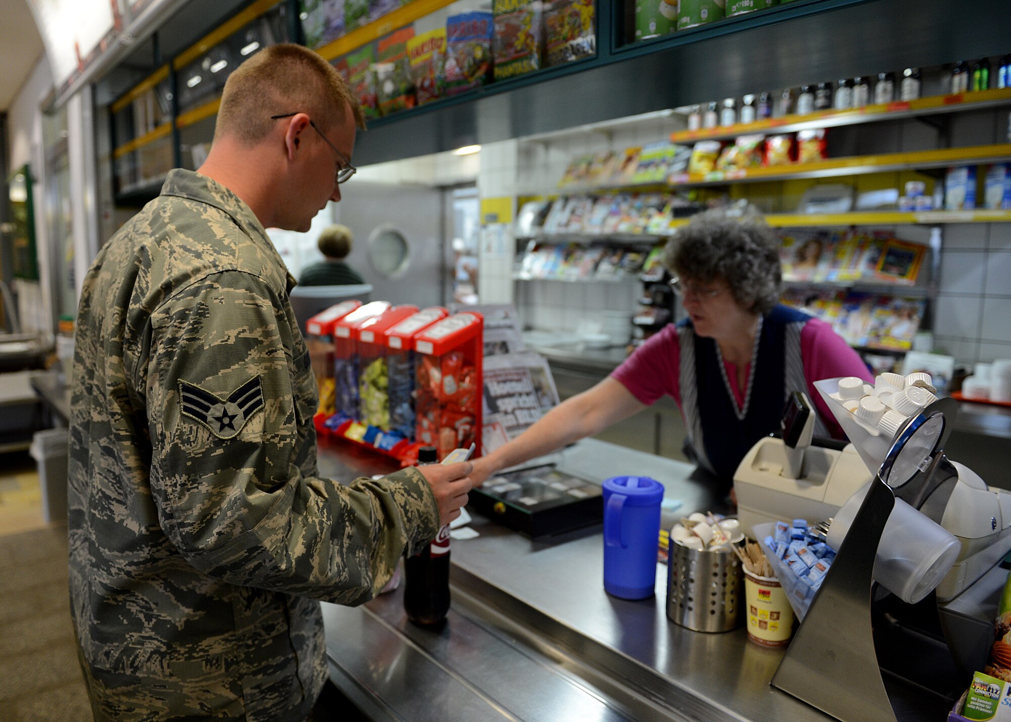U.S. Air Force Robert Gordon, 606th Air Control Squadron power production apprentice, orders food during a stop at Schwarzenborn, Germany, June 3, 2014. The convoy vehicles experienced some mechanical issues that required support from Spangdahlem Air Base’s vehicle maintenance personnel. The Bundeswehr, or German armed forces, hosted U.S. Airmen from Spangdahlem Air Base, Germany, while waiting for a replacement part before continuing to Powidz Air  Base, Poland, to provide air control to NATO air assets during various combined exercises. (U.S. Air Force photo by Airman 1st Class Kyle Gese/Released)
