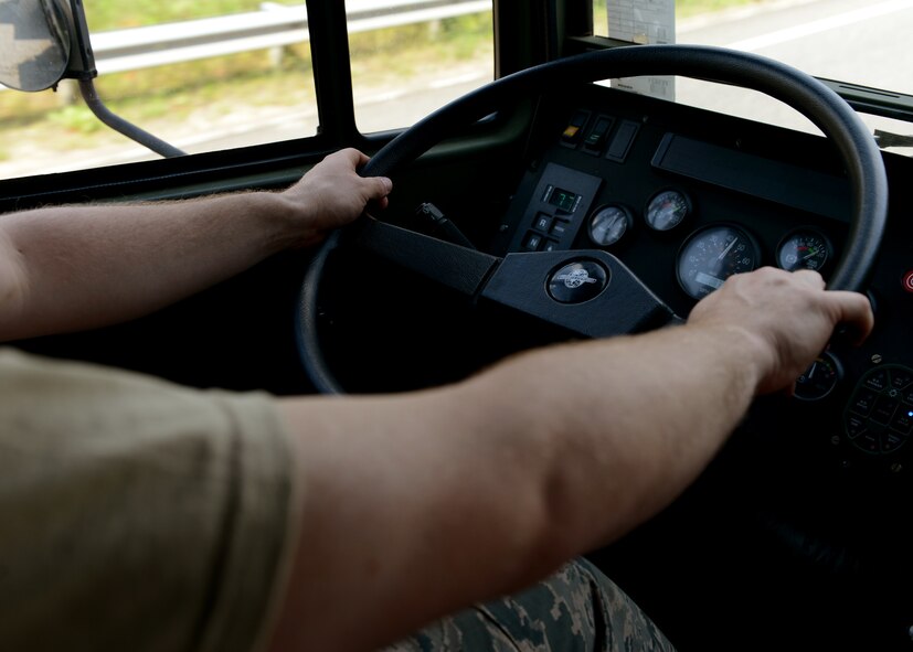U.S. Air Force Senior Airman Robert Gordon, 606th Air Control Squadron power production apprentice, drives a truck in a convoy to Powidz Air Base, Poland, June 2, 2014. The 606th ACS contains more than 21 different specialties that will help to provide communication support to NATO air assets from the United Kingdom, U.S., France and Poland.  (U.S. Air Force photo by Airman 1st Class Kyle Gese/Released)