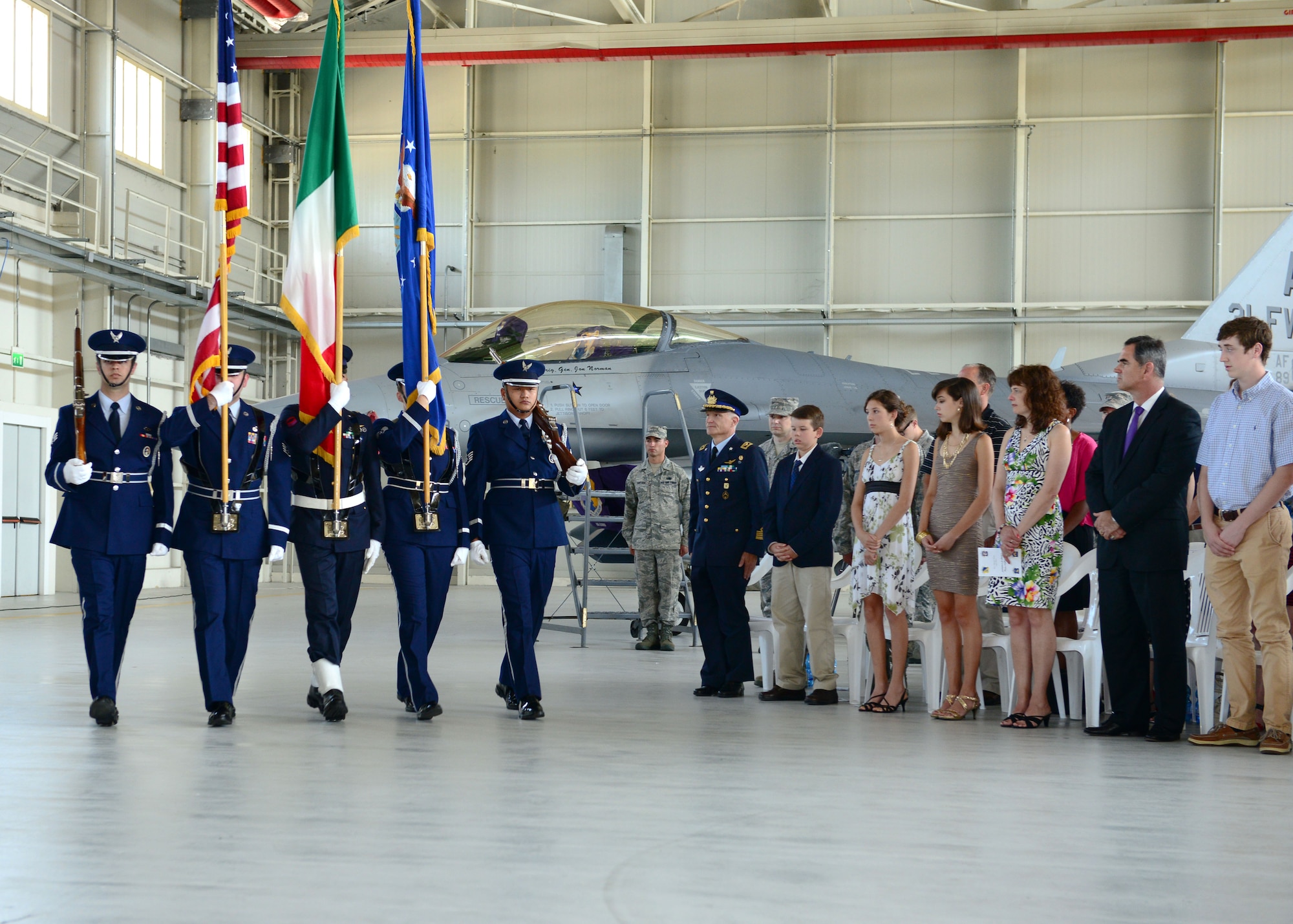 Members from the Aviano Air Base honor guard post colors during the wing change of command ceremony, June 9, 2014, at Aviano Air Base, Italy. Hundreds of Team Aviano members attended the ceremony and watched Seguin become the 13th commander to take the reins of the 31st FW since it relocated to Aviano, Italy from Homestead, Fla. (U.S. Air Force photo/Senior Airman Matthew Lotz)