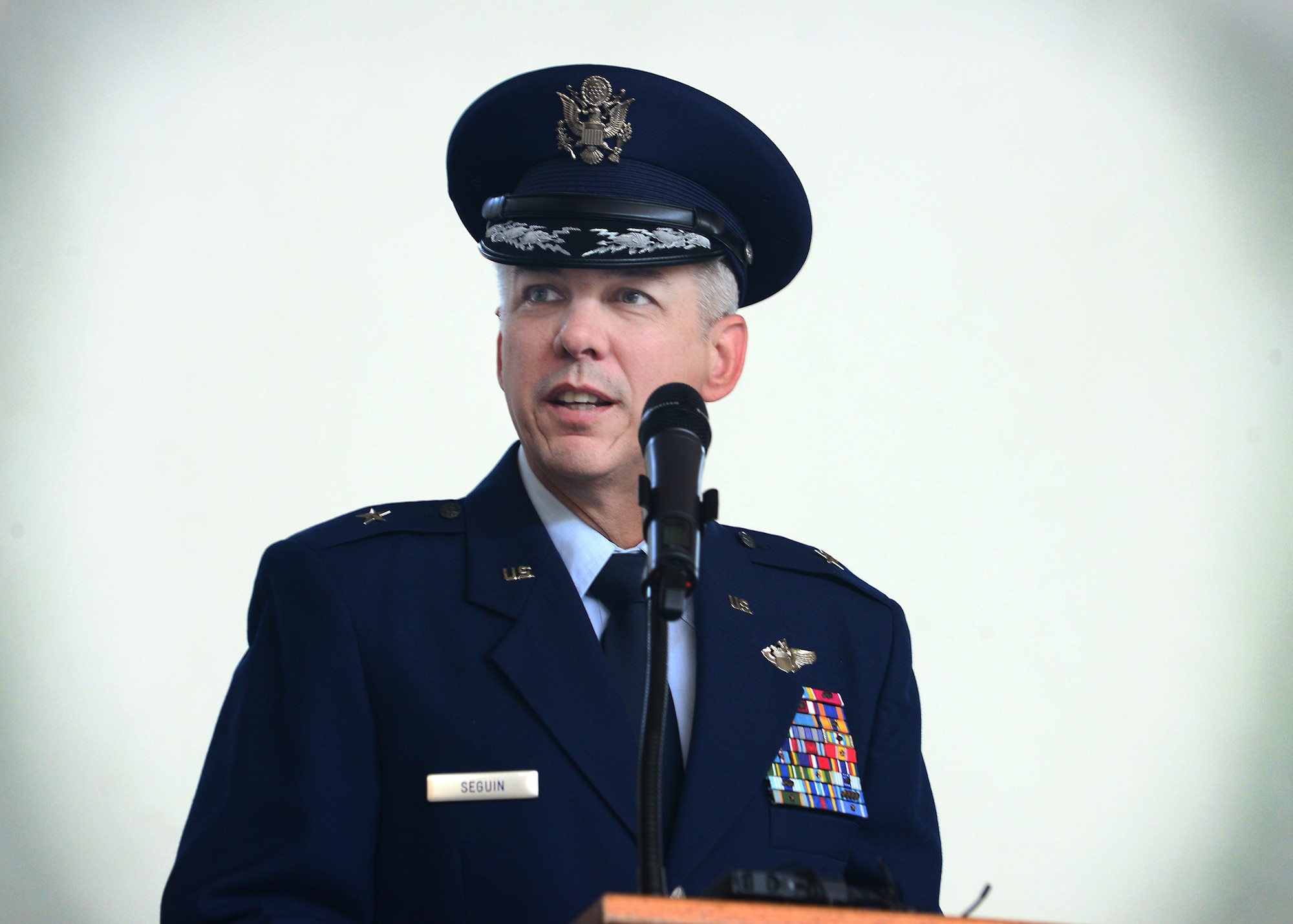 Brig. Gen. Barre R. Seguin, 31st Fighter Wing commander, speaks to Team Aviano members during the wing change of command ceremony, June 9, 2014, at Aviano Air Base, Italy. Hundreds of Team Aviano members attended the ceremony and watched Seguin become the 13th commander to take the reins of the 31st FW since it relocated to Aviano, Italy from Homestead, Fla. (U.S. Air Force photo/Senior Airman Matthew Lotz) 