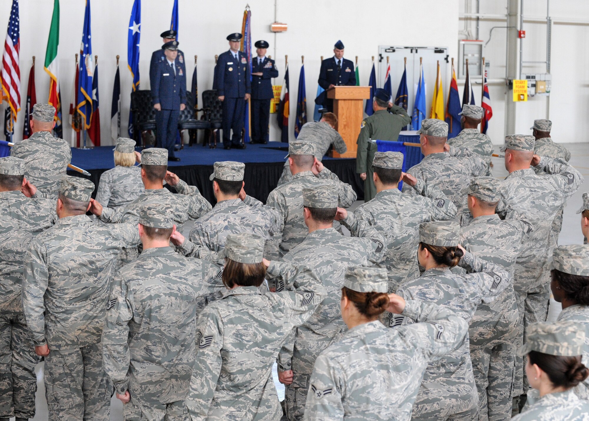 Members from the 31st Fighter Wing salute during a ceremony, June 9, 2014, at Aviano Air Base, Italy. During the ceremony, Gen. Frank Gorenc, U.S. Air Forces in Europe, U.S. Air Forces Africa commander, highlighted Seguin’s achievements from previous leadership opportunities at other bases. (U.S. Air Force photo/Airman 1st Class Ryan Conroy)