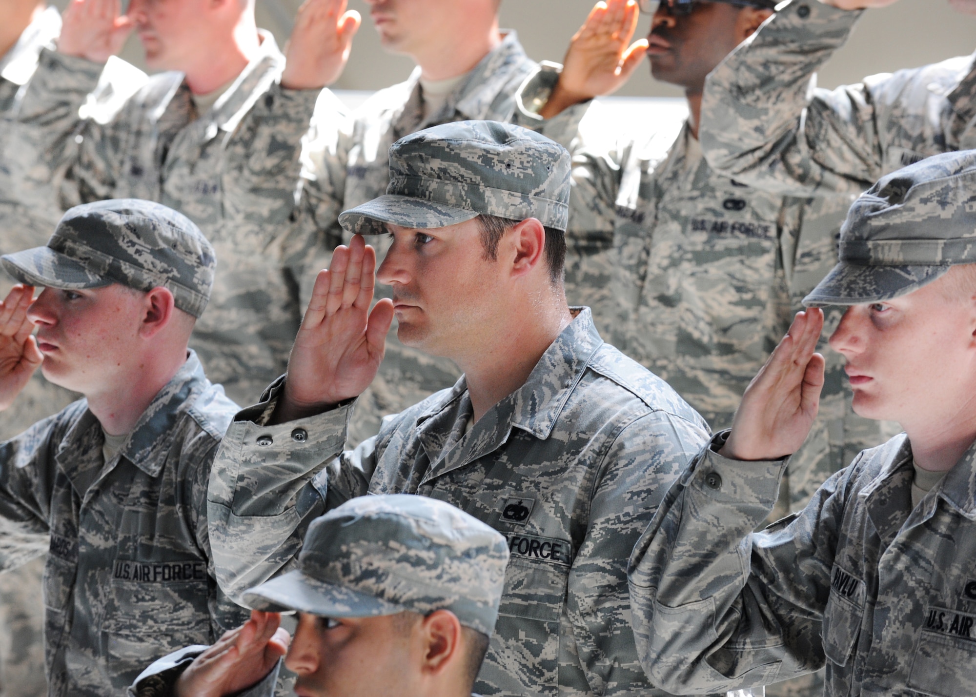 Members from the 31st Fighter Wing salute during a ceremony, June 9, 2014, at Aviano Air Base, Italy. During the ceremony, Gen. Frank Gorenc, U.S. Air Forces in Europe, U.S. Air Forces Africa commander, highlighted Seguin’s achievements from previous leadership opportunities at other bases. (U.S. Air Force photo/Airman 1st Class Ryan Conroy)