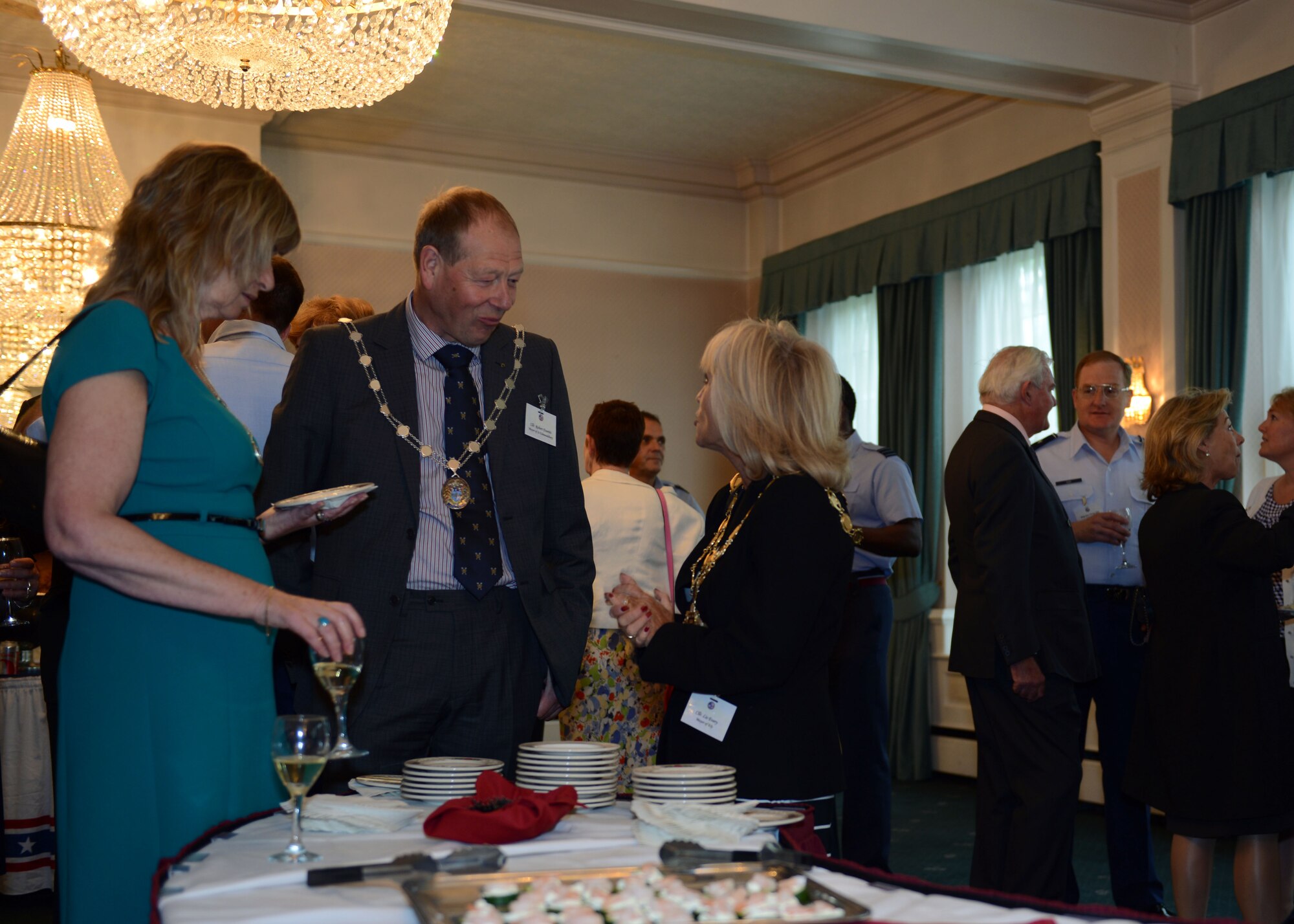 Local community and U.S. Force leaders mingle at the U.S. Air Forces in Europe-United Kingdom 2014 Spring Reception May 30, 2014, at Middleton Hall on RAF Mildenhall, England. The reception allows social bonds to be built between U.S. personnel and members of the local community. (U.S. Air Force photo/Airman 1st Class Preston Webb/Released)