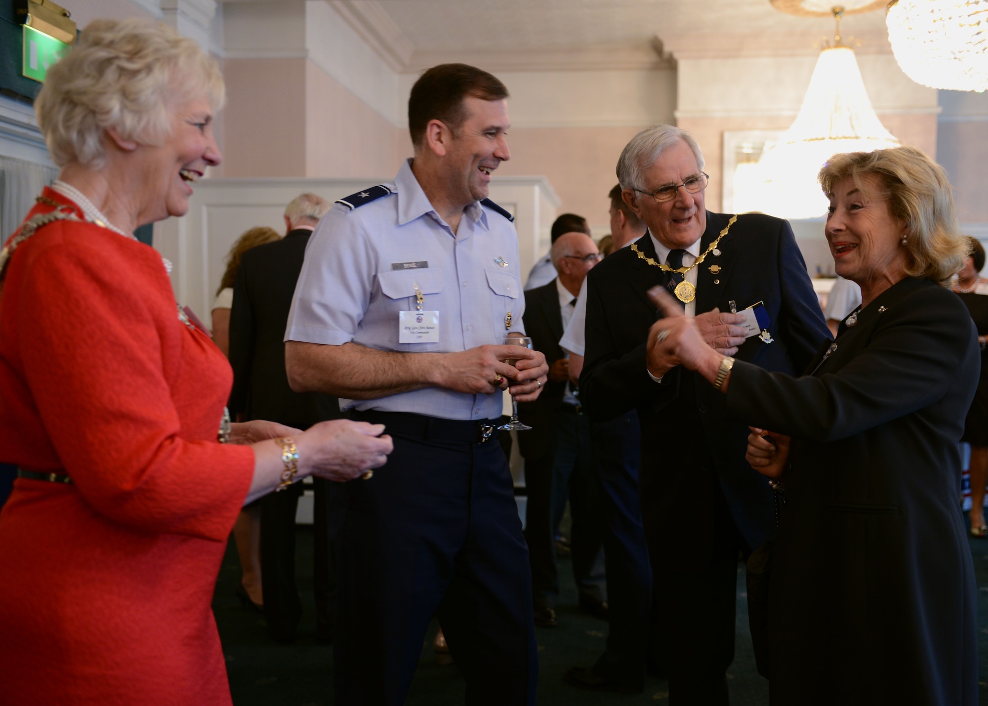 From left to right, Councillor Sylvia Armes, Mayor of Thetford, Norfolk; U.S. Air Force Brig. Gen. Christopher J. Bence, 3rd Air Force vice commander; Colin Armes, husband of Sylvia Armes; and Lady Sarah Leicester, High Sheriff of Norfolk, share stories during the USAFE-UK 2014 Spring Reception May 30, 2014, at Middleton Hall on RAF Mildenhall, England. The reception offered an opportunity for local community and military leaders to become acquainted. (U.S. Air Force photo/Airman 1st Class Preston Webb/Released)