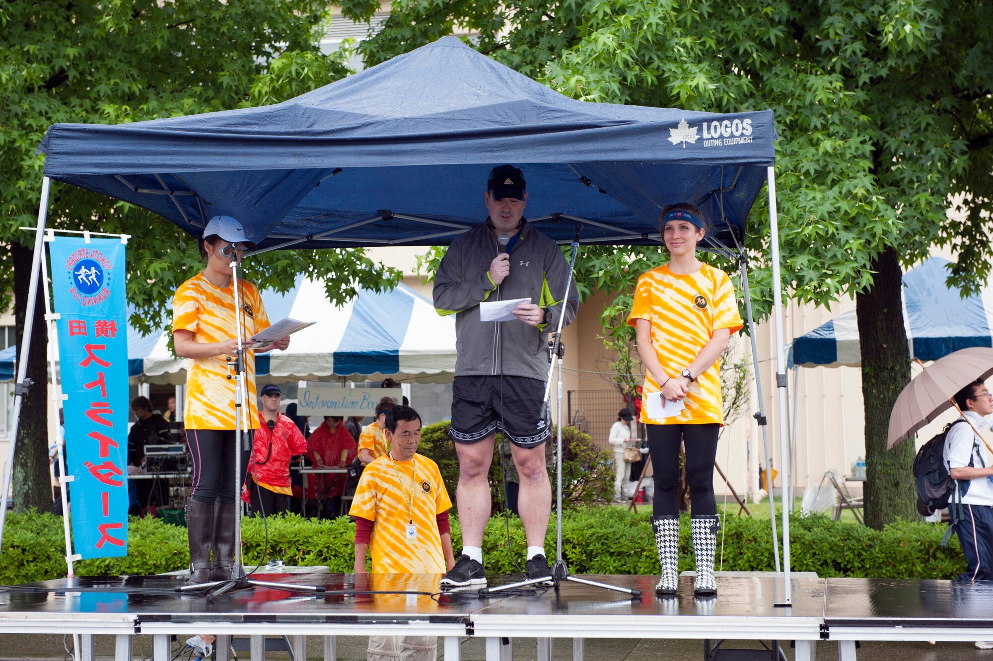 Col. Mark August, 374th Airlift Wing commander, welcomes runners at the Ekiden opening ceremony June 8, 2014, at Yokota Air Base, Japan. More than 2400 runners and an additional 450 volunteers participated in the annual event. (U.S. Air Force photo by Senior Airman Desiree Economides/Released)