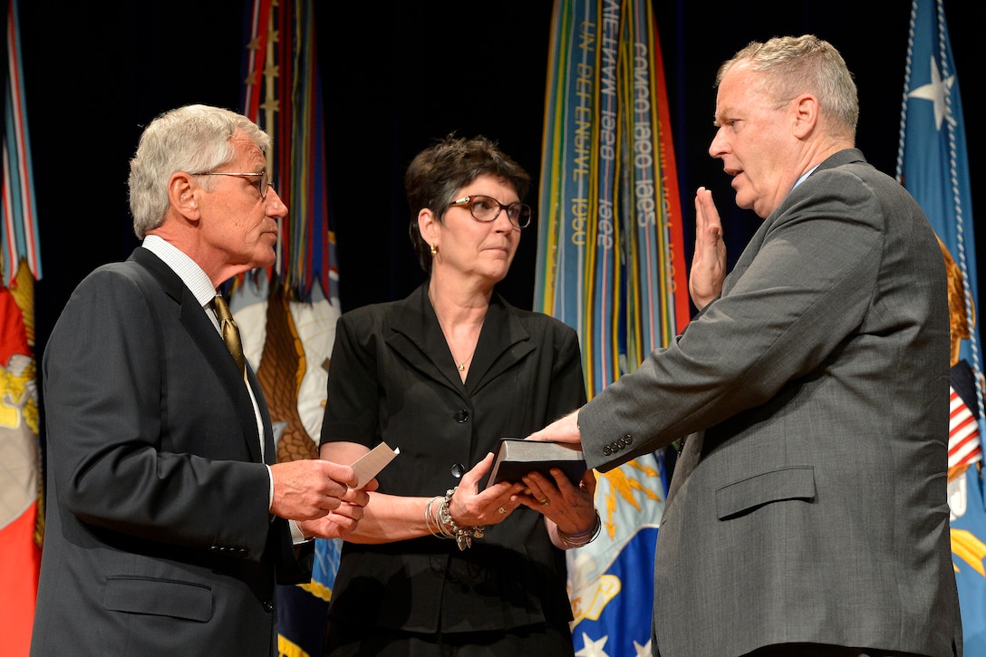 Defense Secretary Chuck Hagel, Left, Administers The Oath Of Office To ...