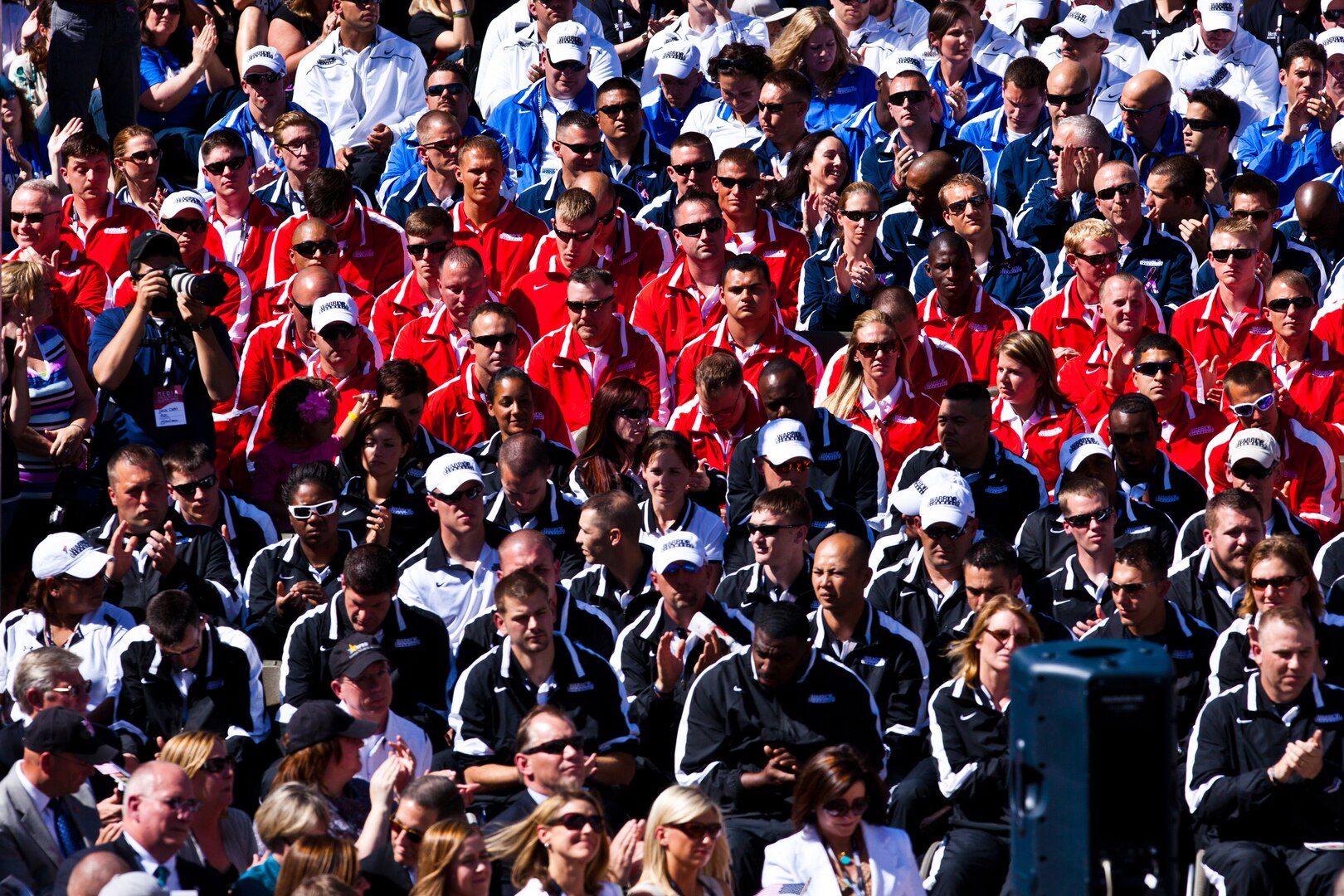 At the 2012 Warrior Games, consisting of 200 wounded, ill or injured service members from the Marine Corps, Navy, Air Force, Coast Guard and Special Operations Command competing in a Paralympics-style competition, athletes sit and listen to opening day remarks April 30, 2012 in Colorado Springs, Colo. The competition is from May 1 to 5, 2012.