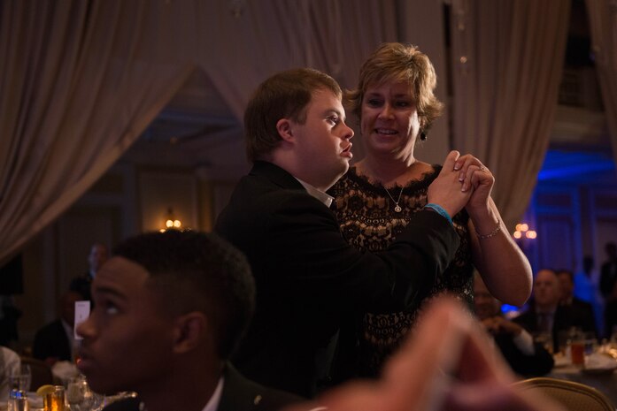 Pam Sharp and her son, Andrew Sharp, eighth year attendees at the 9th Annual National Capital Area A Cinderella Ball, dance here, June 8, 2014. The Cinderella Ball, held at the Willard InterContinental Hotel, gives middle and high school students with disabilities or life-threatening illnesses the opportunity to attend a prom event. 