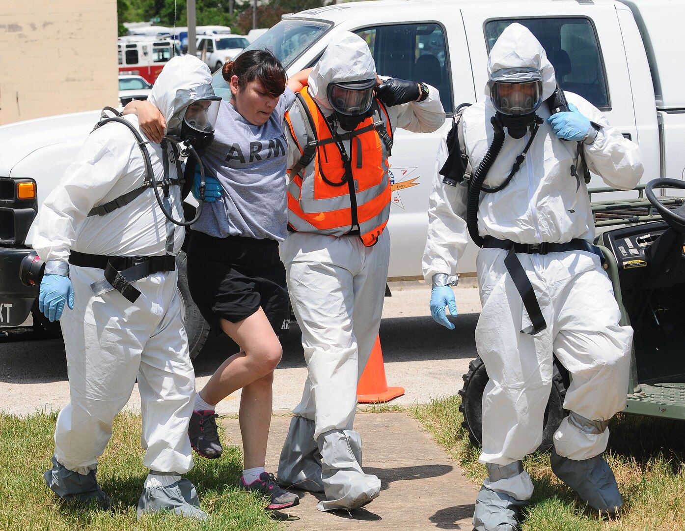 Soldiers from Texas National Guard's 436th Chemical Company and the 236th Military Police Company assist a casualty while conducting a collective training exercise at the Govalle Water Treatment Facility in Austin, Texas, April 26 to 27, 2012. This exercise helps Joint Task Force 71 maintain readiness to conduct the Homeland Response Force mission throughout Federal Emergency Management Agency Region 6.