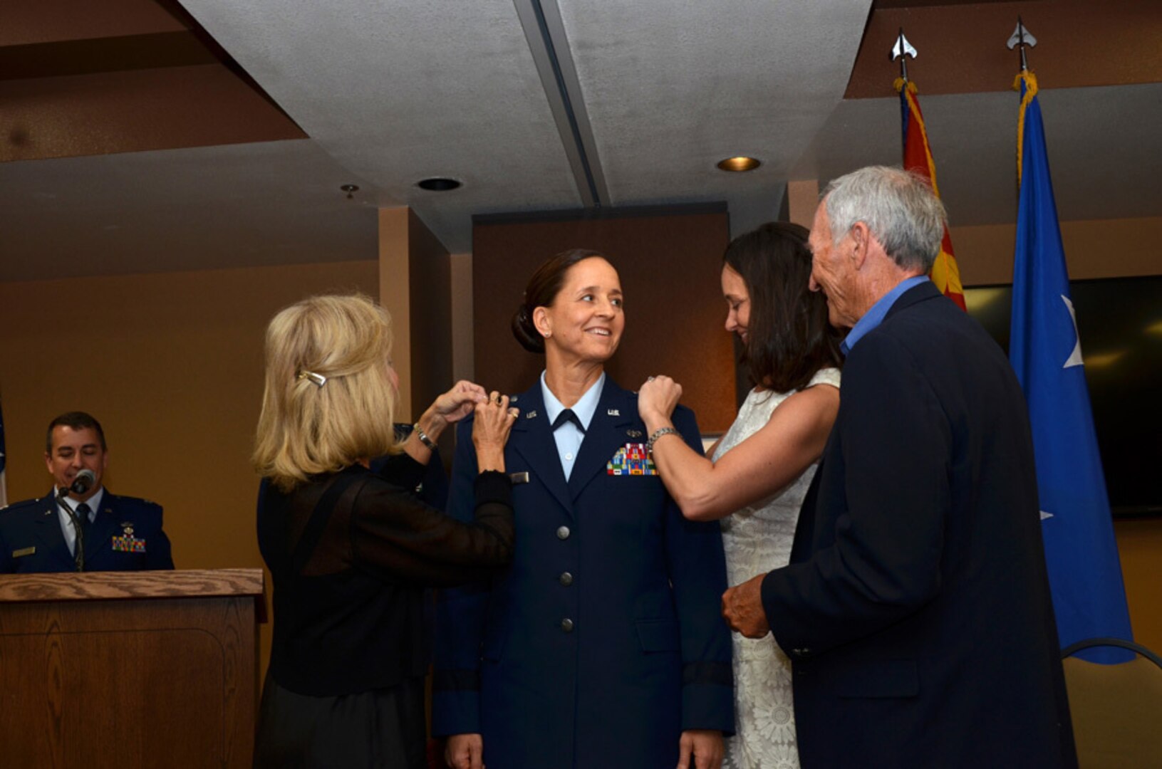 U.S. Air Force Col. Kerry L. Muehlenbeck was promoted to brigadier general June 7, 2014, at the 161st Air Refueling Wing, Phoenix. Her parents, Bill and Nancy Muehlenbeck, and her sister, Kelly Adams, pin on her new rank during her promotion ceremony.