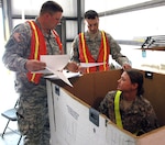 Members of the New York Army National Guard's B Battery 27th Brigade Support Troops Battalion, compare stock numbers with the non-rolling stock in a container March 18, 2012. This training was part of the Redistribution Property Assistance Team Academy that brought to Camp Shelby Joint Forces Training Center. The 27th BTSB is the first unit to receive this training prior to deployment.