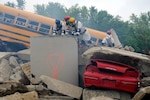 Soldiers of the Ohio National Guard's Chemical, Biological, Radiological, Nuclear Enhanced Response Force Package search for role players in the role of casualties amongst wreckage during a training exercise at Camp Sherman Joint Training Center, Ohio, May 5, 2012. The training exercise included Ohio National Guard members as well as personnel from a variety of local, state and federal emergency responders.