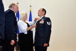 Tech. Sgt. Tavis J. Delaney, with the Washington Air National Guard's 116th Air Support Operations Squadron, stands at attention as his wife Courtney pins the Silver Star medal to his uniform during a presentation ceremony at Joint Base Lewis-McChord, Wash,, May 6, 2012. Delaney received the award—the nation's third highest award for valor in action—for actions in combat during his 2011 deployment to Afghanistan with the squadron.