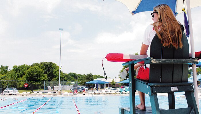 Tori Larned, a lifeguard, watches over the Quantico 50M Pool aboard Marine Corps Base Quantico on May 27, 2014. The pool opened for the season during Memorial Day Weekend, offering patrons enhanced amenities and more swim sessions.