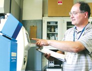 Robert Eldelman, the district engineer at the Virginia Department of Health’s Office of Drinking Water, measures organic material in raw, unfiltered water using a Total Organic Carbon Analyzer at Marine Corps Base Quantico’s Mainside Water Treatment Plant on May 29, 2014.