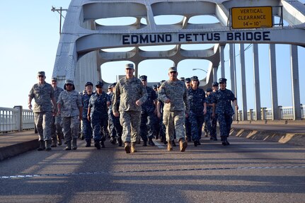 Army Brig. Gen. Arthur W. Hinaman, the land component commander of the District of Columbia National Guard, and Army Command Sgt. Maj. Richard Espinosa, lead a group of 200 Soldiers, Sailors and Airmen across the Edmund Pettus Bridge in Selma, Alabama, May 7, 2012.