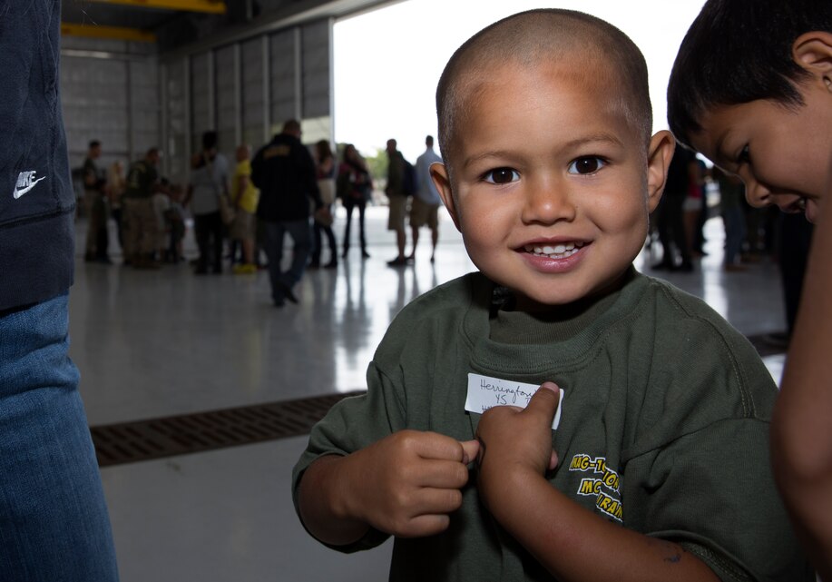 Seamus Herrington, a Junior Jarhead with Marine Aircraft Group (MAG) 16, smiles for a photo before falling in to formation during the group’s Junior Jarhead Day aboard Marine Corps Air Station Miramar, Calif., June 7. MAG-16 invited Marines, Sailors and families to bring their children to the event for a fun day of learning about the Marine Corps.