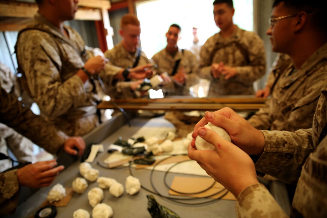 FORT POLK, La. – Assaultmen with 1st Battalion, 23rd Marine Regiment, prepare C4 explosives during a demolition range here, June 3. Marines took part in numerous live-fire ranges, which culminated in a platoon-sized attack as a part of the unit’s annual training. The battalion’s assualtmen were responsible for breaching mock enemy obstacles and clearing the way for follow-on forces.  (Photo by Cpl. John M. McCall)