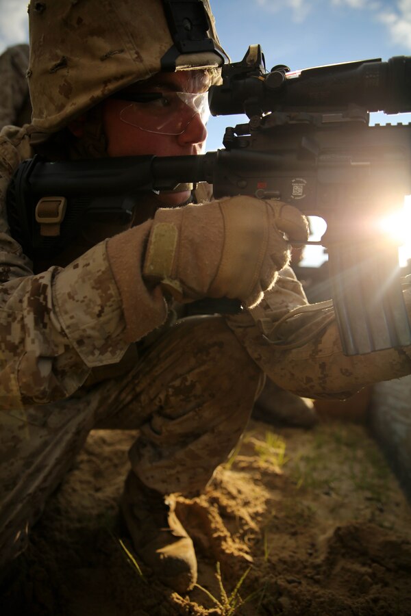 FORT POLK, La. – Lance Cpl. Nicholas Arthus, a machine gunner with 1st Battalion, 23rd Marine Regiment, and a native of Pittsburgh, fires an infantry automatic rifle during a live fire range here, June 2. Marines took part in numerous live fire ranges, which culminated in a platoon size attack as a part of the unit’s annual training. (Photo by Cpl. John M. McCall)