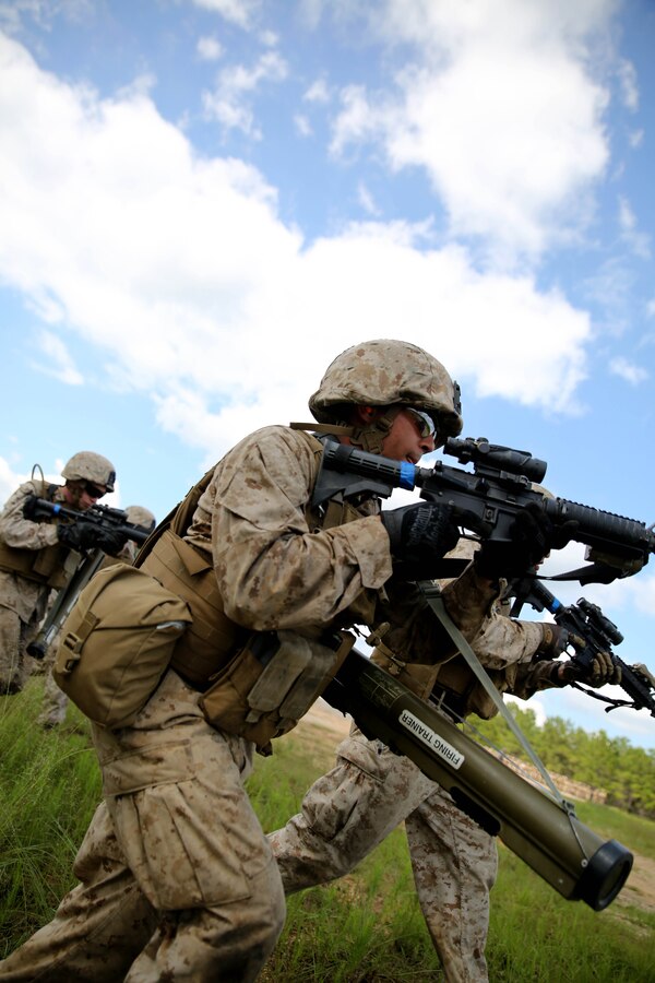 FORT POLK, La. – Assaultmen with 1st Battalion, 23rd Marine Regiment, maneuver toward their objective during a live fire range here, June 3. Marines took part in numerous live fire ranges, which culminated in a platoon size attack as a part of the unit’s annual training. The battalion’s assualtmen were responsible for breaching enemy obstacles and clearing the way for follow on forces. (Photo by Cpl. John M. McCall)