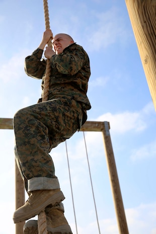 Recruit Ryan R. Peterfeso, Platoon 2176, Hotel Company, 2nd Recruit Training Battalion, climbs a rope during an obstacle course at Marine Corps Recruit Depot San Diego, June 5. The rope climb exercise was followed by a combat carry exercise.