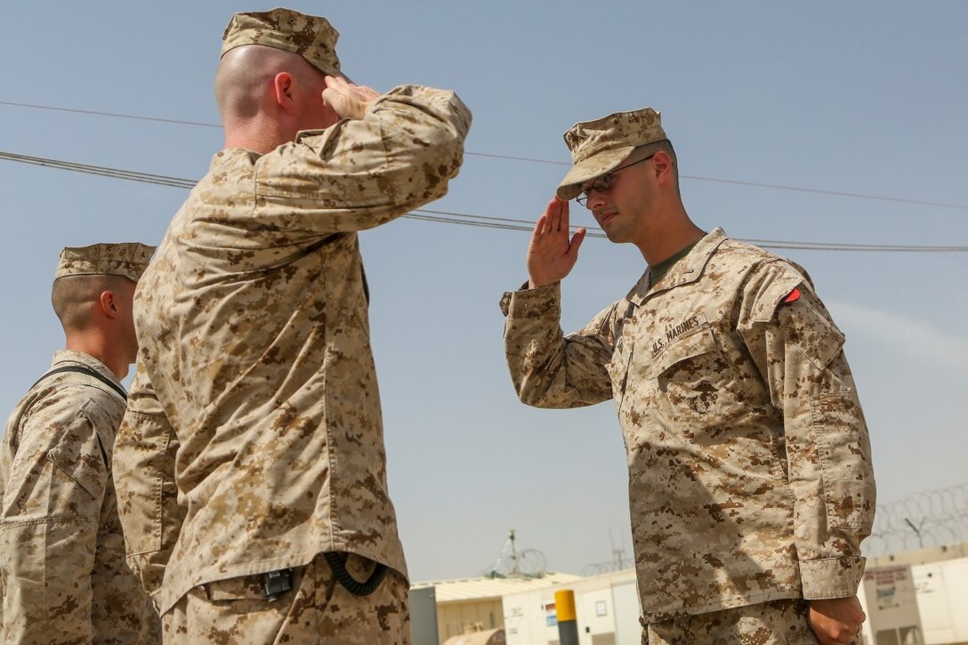 Newly promoted 1st Lt. Jarred Sabia, right, salutes Lt. Col. Bradley Weston, commanding officer, 1st Battalion, 2nd Marine Regiment, during a promotion ceremony aboard Camp Leatherneck, Afghanistan, May 29, 2014. “I joined the Marine Corps for the opportunity to lead Marines, which to me is America’s best fighting force hands down,” said Sabia, a native of Savannah. Sabia is the maintenance management officer with 1st Bn., 2nd Marines. (Marine Corps photo by Cpl. Michael Dye/ Released)