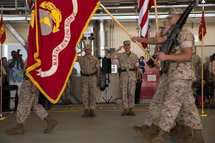 Lt. Col. Kolter R. Miller, commanding officer of Marine Aviation Logistics Squadron 12, left, and Lt. Col. Michael D. Gonzalez salute colors during the MALS-12 change of command aboard Marine Corps Air Station Iwakuni, Japan, June 9, 2014. Miller is taking over the first command of his career and said he is confident he is able to fill Gonzalez’s shoes.