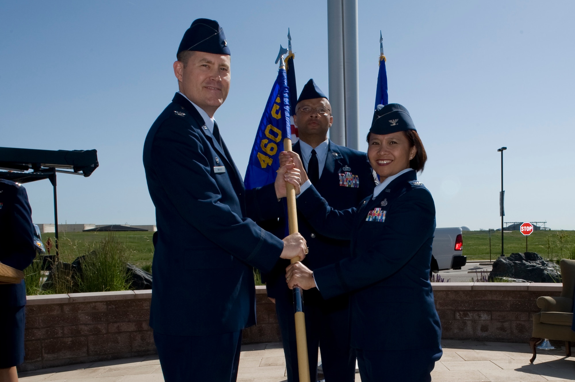 Col. Dan Wright, 460th Space Wing commander, presents the 460th Mission Support Group flag to Col. Rose Jourdan, 460th MSG commander, to symbolize her assumption of command June 10, 2014, at the 460th SW Headquarters on Buckley Air Force Base, Colo. During the ceremony, Jourdan assumed command of the 460th MSG from Col. Robert Uemura, who served as the commander since June 2012. (U.S. Air Force photo by Senior Airman Phillip Houk/Released)