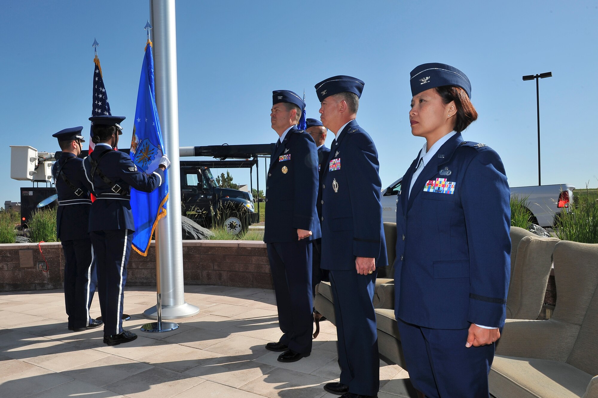 The Mile High Honor Guard presents the colors during the 460th Mission Support Group change of command ceremony June 10, 2014, at the 460th Space Wing Headquarters on Buckley Air Force Base, Colo. During the ceremony, Col. Rose Jourdan, right, assumed command of the 460th MSG from Col. Robert Uemura. (U.S. Air Force photo by Senior Airman Phillip Houk/Released)