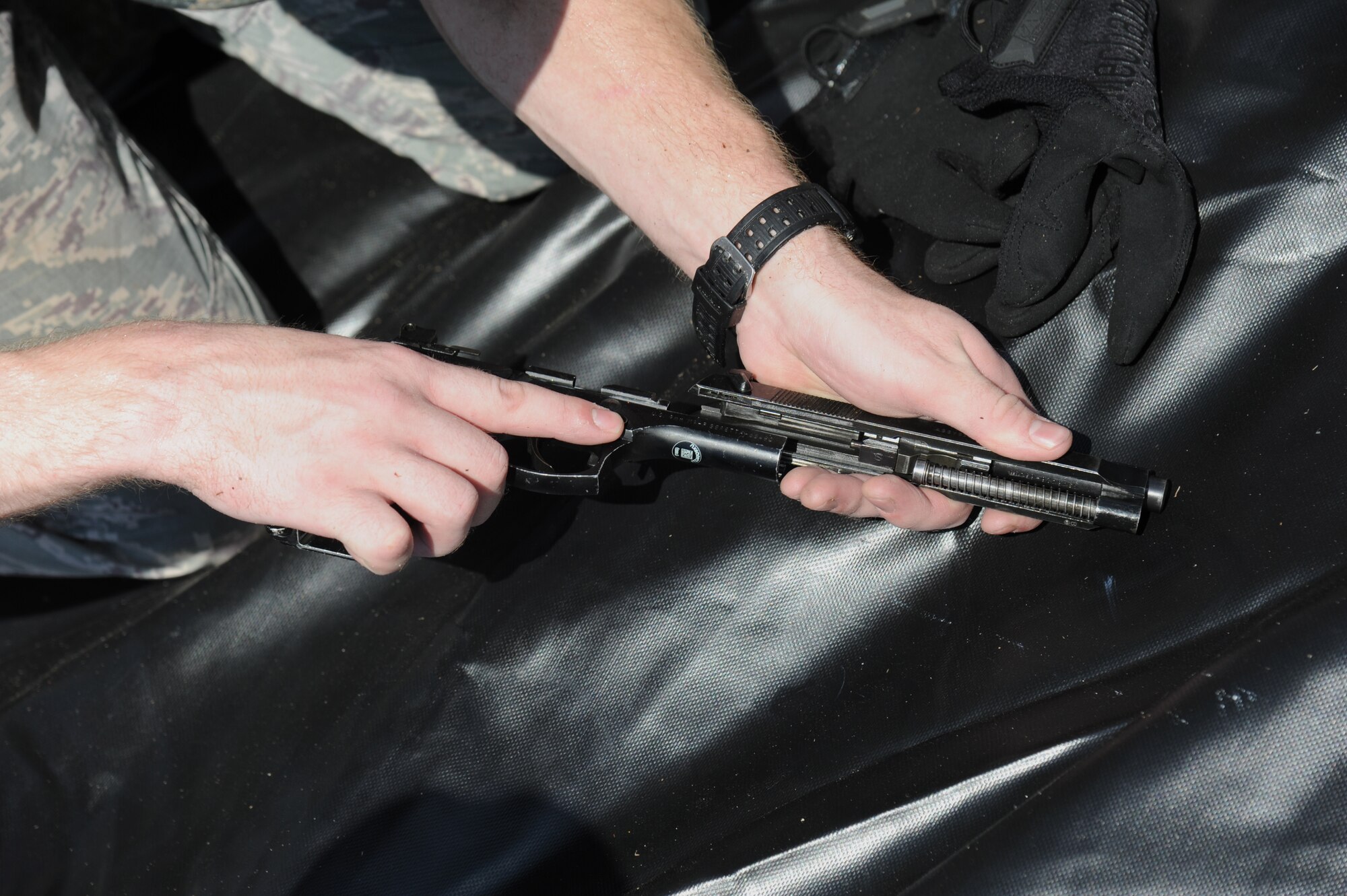 A Justice League team member from the 85th Engineering Installation Squadron assembles a M4 weapon in the “Assembled Weapons” challenge during the 81st Training Wing Warrior Challenge hosted by the 81st Mission Support Group June 6, 2014, at the Triangle Track, Keesler Air Force Base, Miss. The challenge consists of the assembling and firing of weapons by the watchful of 81st Security Forces combat arms members. The challenge was held in memory of the 70th anniversary of The Normandy Invasion also known as D-Day.  It consisted of nine six-member teams racing in a competition designed to take them through various aspects of a deployment. (U.S. Air Force photo by Kemberly Groue)