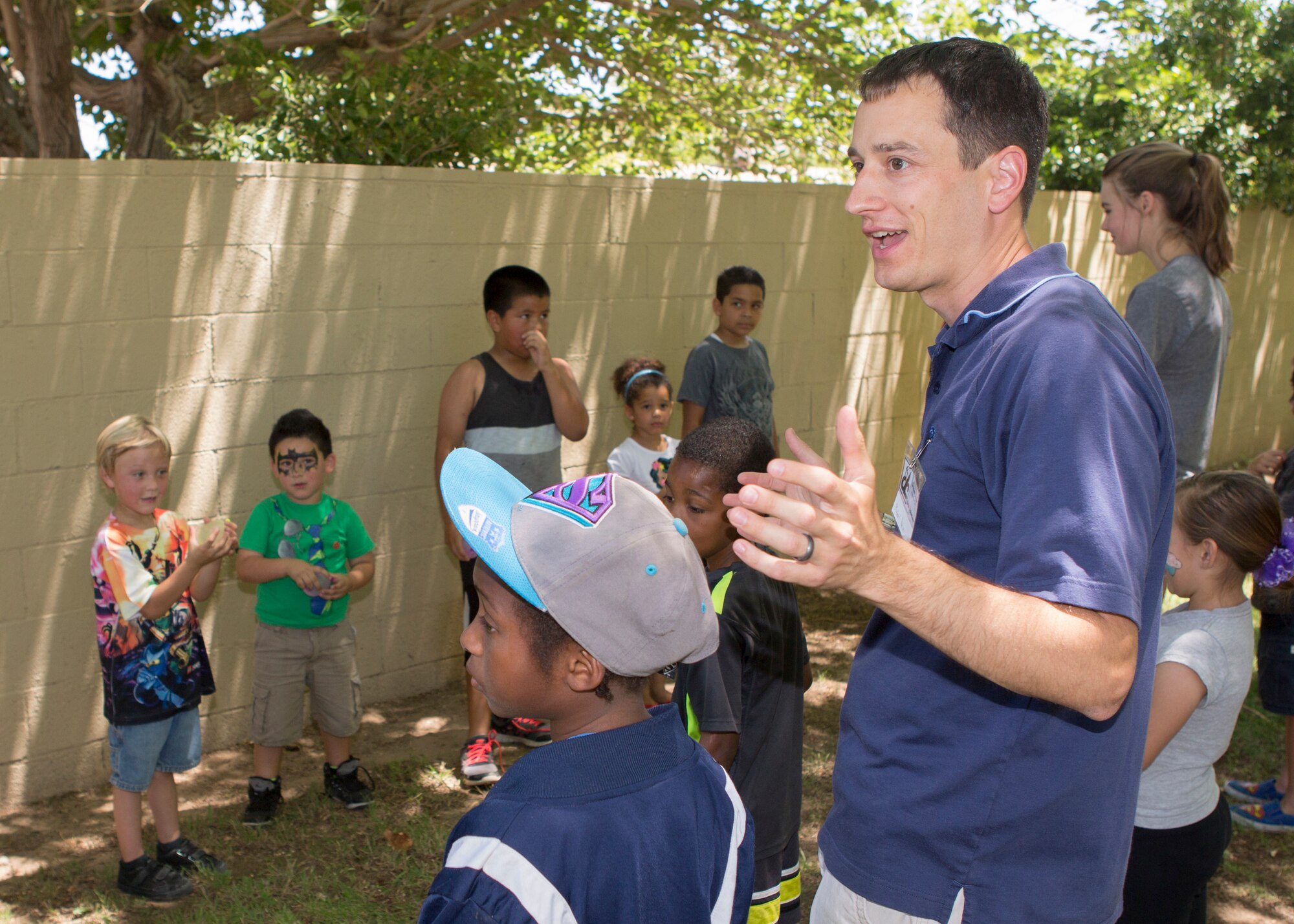Capt. Michael Pacini, 416th Flight Test Squadron, F-16 test pilot and youth leader at the Base Chapel, explains to children the rules of the water balloon toss game they are about to play. On the first Saturday of each month, Antelope Valley Dream Center volunteers gather at Neighborhood Impact Homes where they play games, prepare lunches and teach Bible verses to local children and their parents. Members from the Edwards community and base schools helped volunteered June 7. (Courtesy photo by Edward Cannon)

(Courtesy photo)