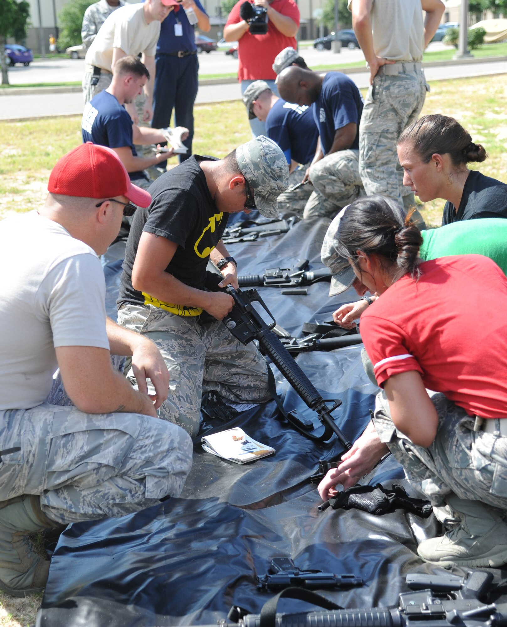The Justice League team member from the 85th Engineering Installation Squadron, Staff Sgt. Randal Hernandez, leads his team in the “Assembled Weapons” challenge during the 81st Training Wing Warrior Challenge hosted by the 81st Mission Support Group June 6, 2014, at the Triangle Track, Keesler Air Force Base, Miss. The challenge consists of the assembling and firing of weapons by the watchful of 81st Security Forces combat arms members. The challenge was held in memory of the 70th anniversary of The Normandy Invasion also known as D-Day.  It consisted of nine six-member teams racing in a competition designed to take them through various aspects of a deployment. (U.S. Air Force photo by Kemberly Groue)