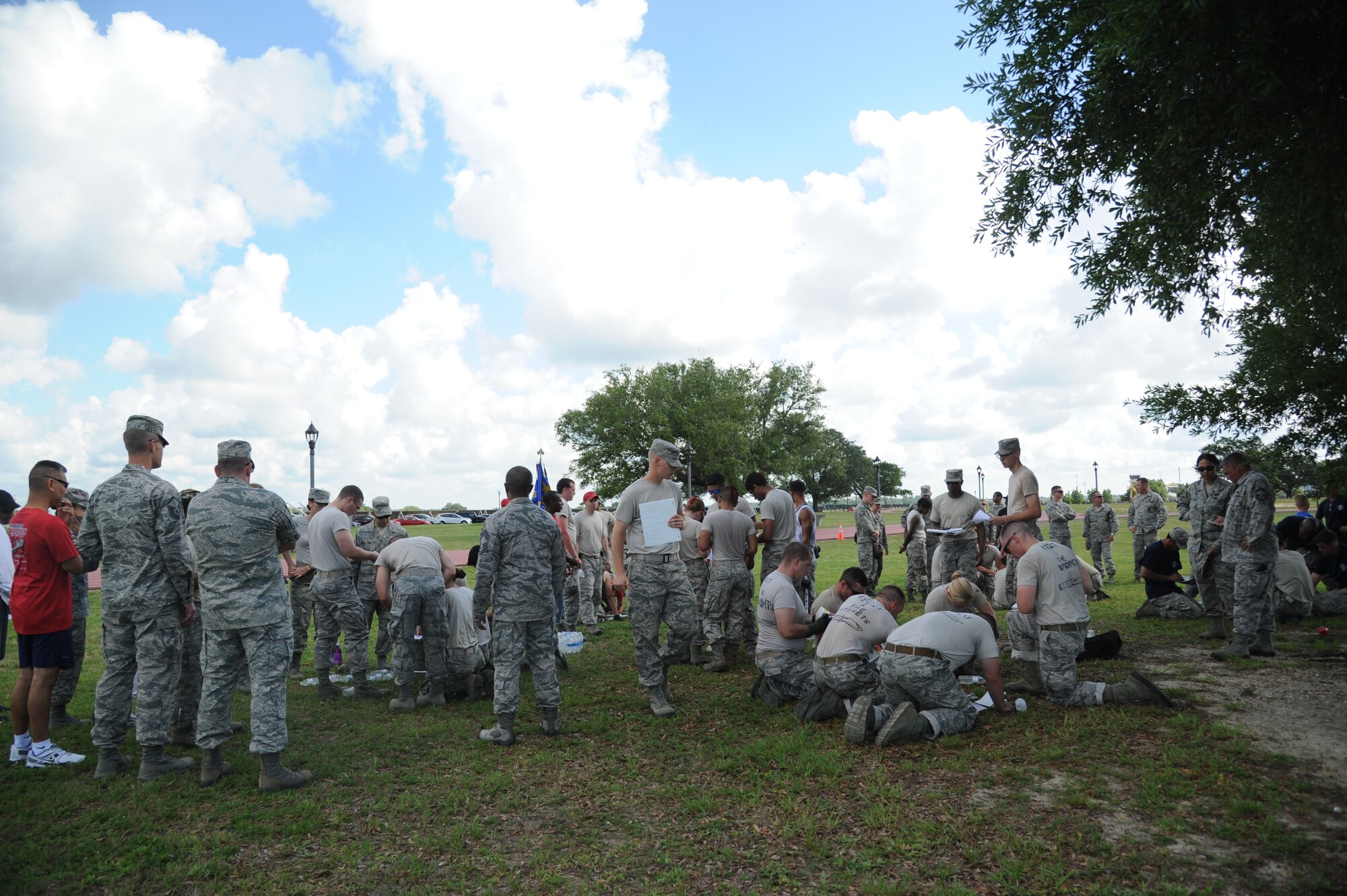 Teams compete in the “20 question quiz” challenge during the 81st Training Wing Warrior Challenge hosted by the 81st Mission Support Group June 6, 2014, at the Triangle Track, Keesler Air Force Base, Miss.  The challenge consisted of answering 20 questions about the Air Force to demonstrate readiness to deploy. The Warrior Challenge event was held in memory of the 70th anniversary of The Normandy Invasion also known as D-Day. (U.S. Air Force photo by Kemberly Groue)